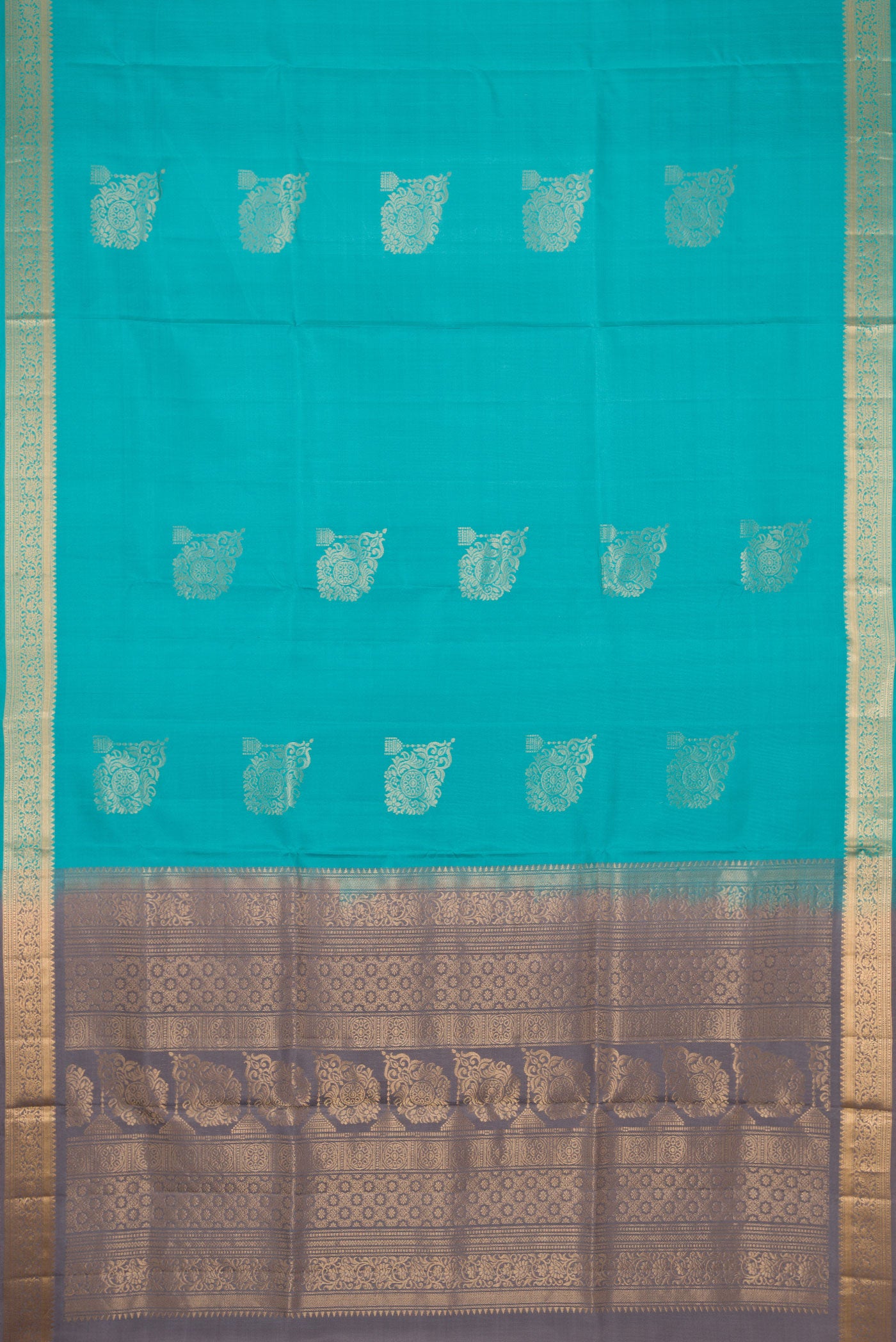 Flat view of Light Blue Dual Tone Soft Silk Saree with Zari Butta on the body and Zari Border. 