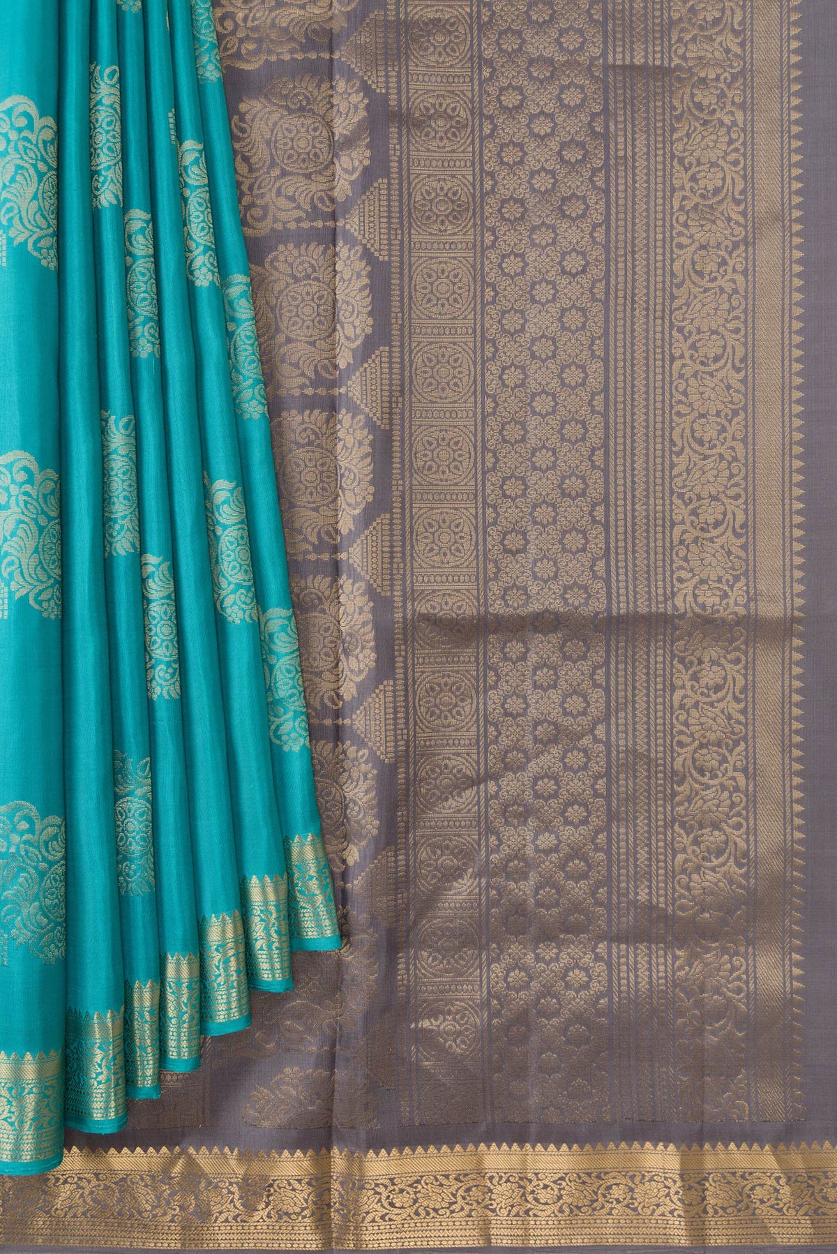 Pleats and pallu of Light Blue Dual Tone Soft Silk Saree with Zari Butta on the body and Zari Border. 