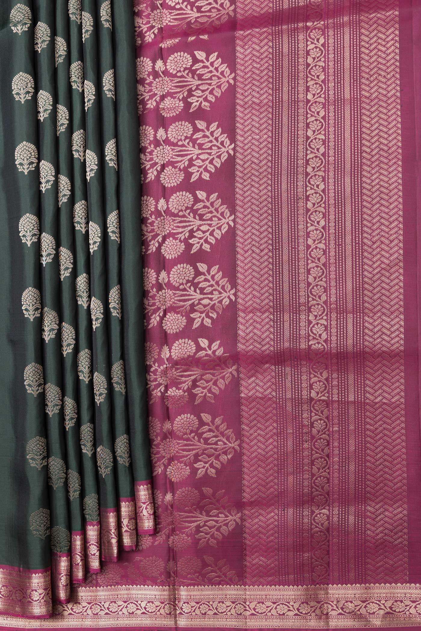 Pleats and pallu of Bottle Green Dual Tone Soft Silk Saree with Zari Butta on the body and Zari Border. 
