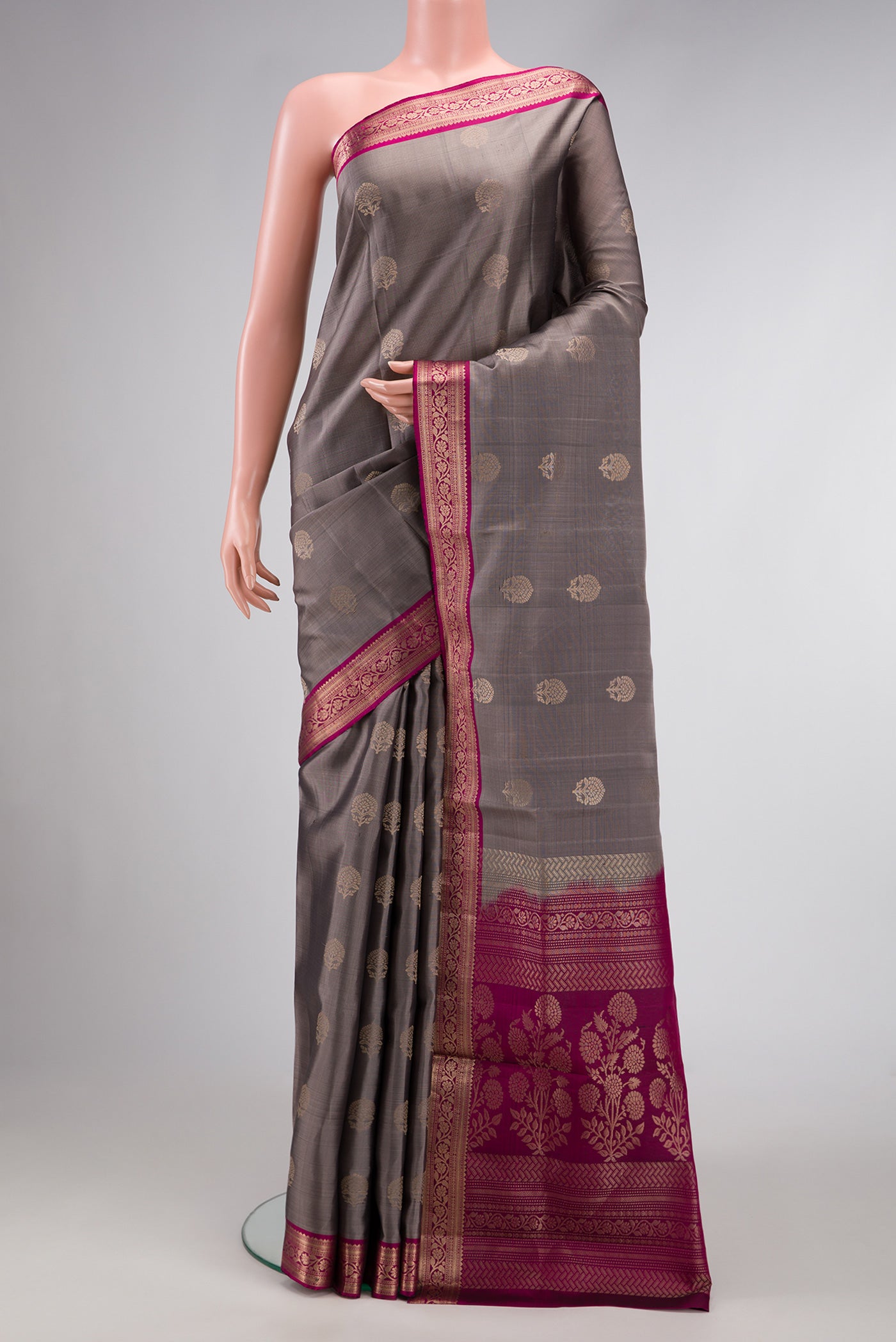 Grey Dual Tone Soft Silk Saree with Zari Butta on the body and Zari Border.  displayed on a mannequin