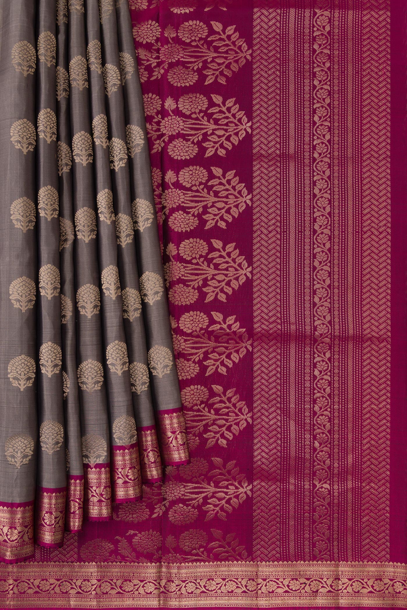 Pleats and pallu of Grey Dual Tone Soft Silk Saree with Zari Butta on the body and Zari Border. 