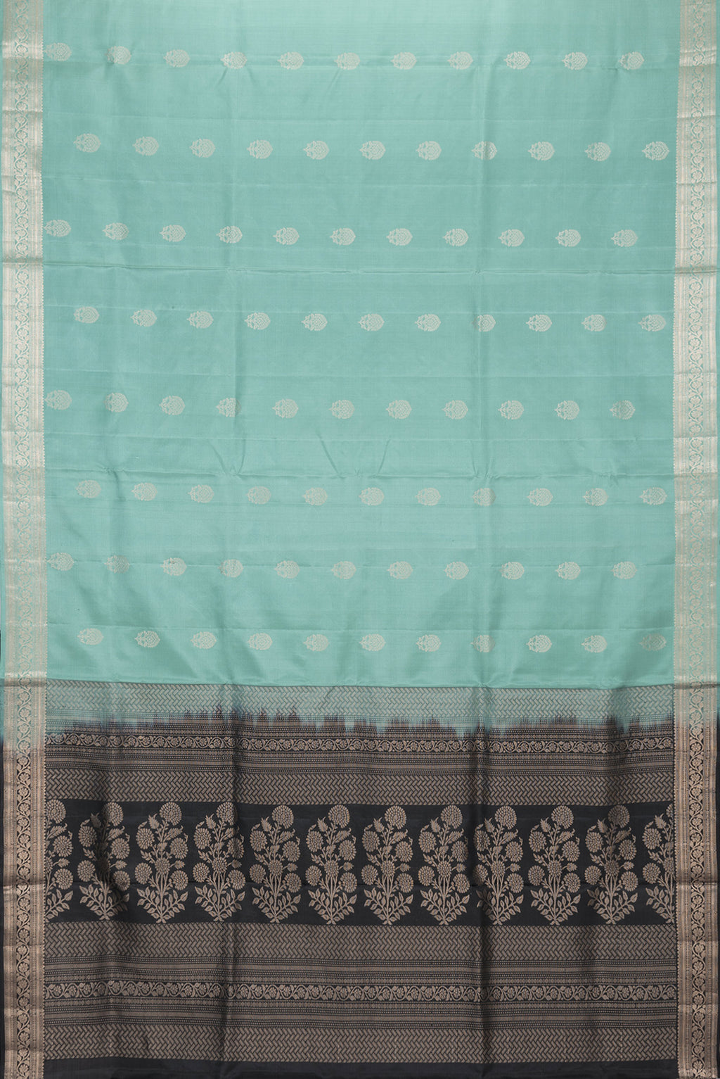 Flat view of Sea Green Dual Tone Soft Silk Saree with Zari Butta on the body and Zari Border. 
