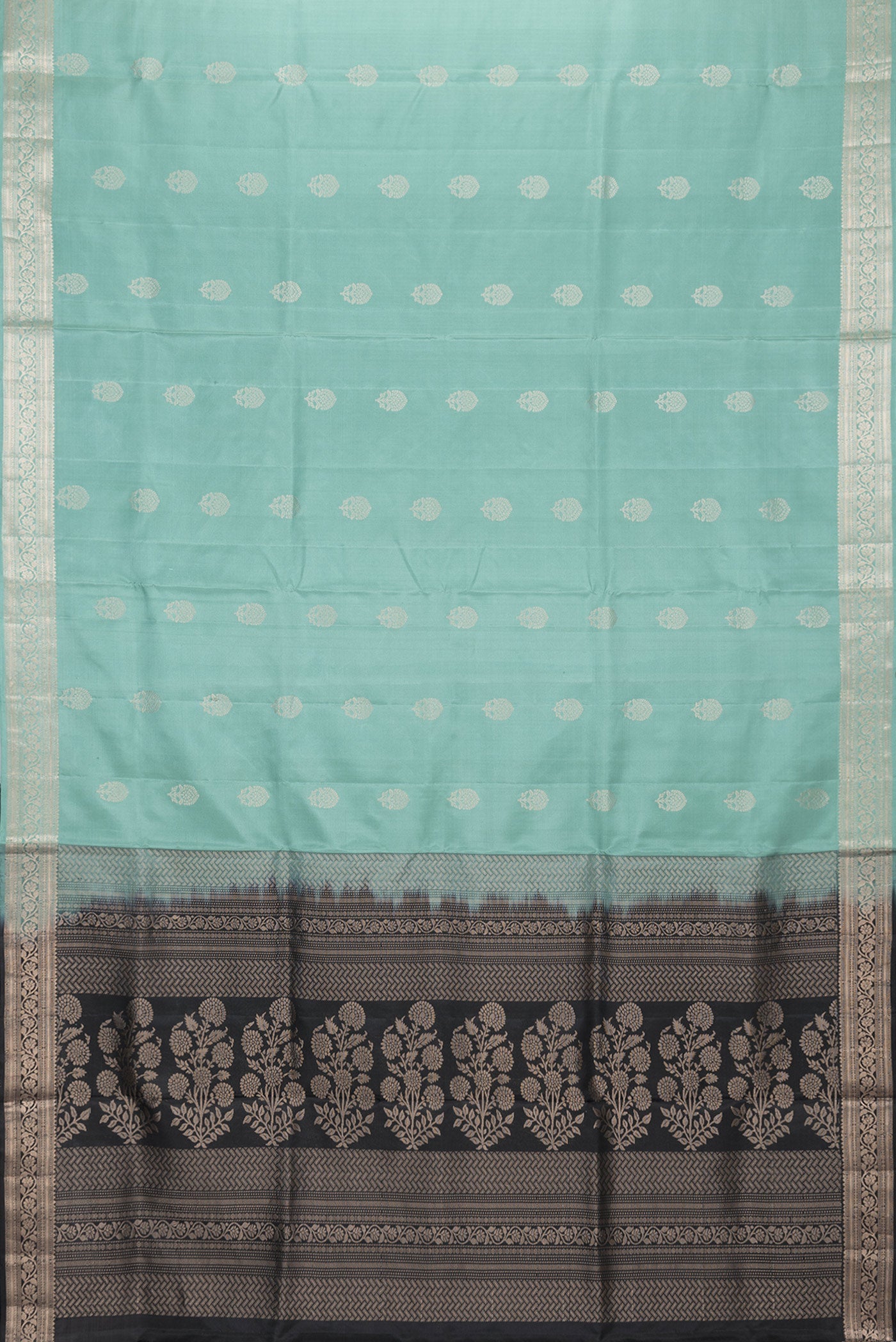 Flat view of Sea Green Dual Tone Soft Silk Saree with Zari Butta on the body and Zari Border. 