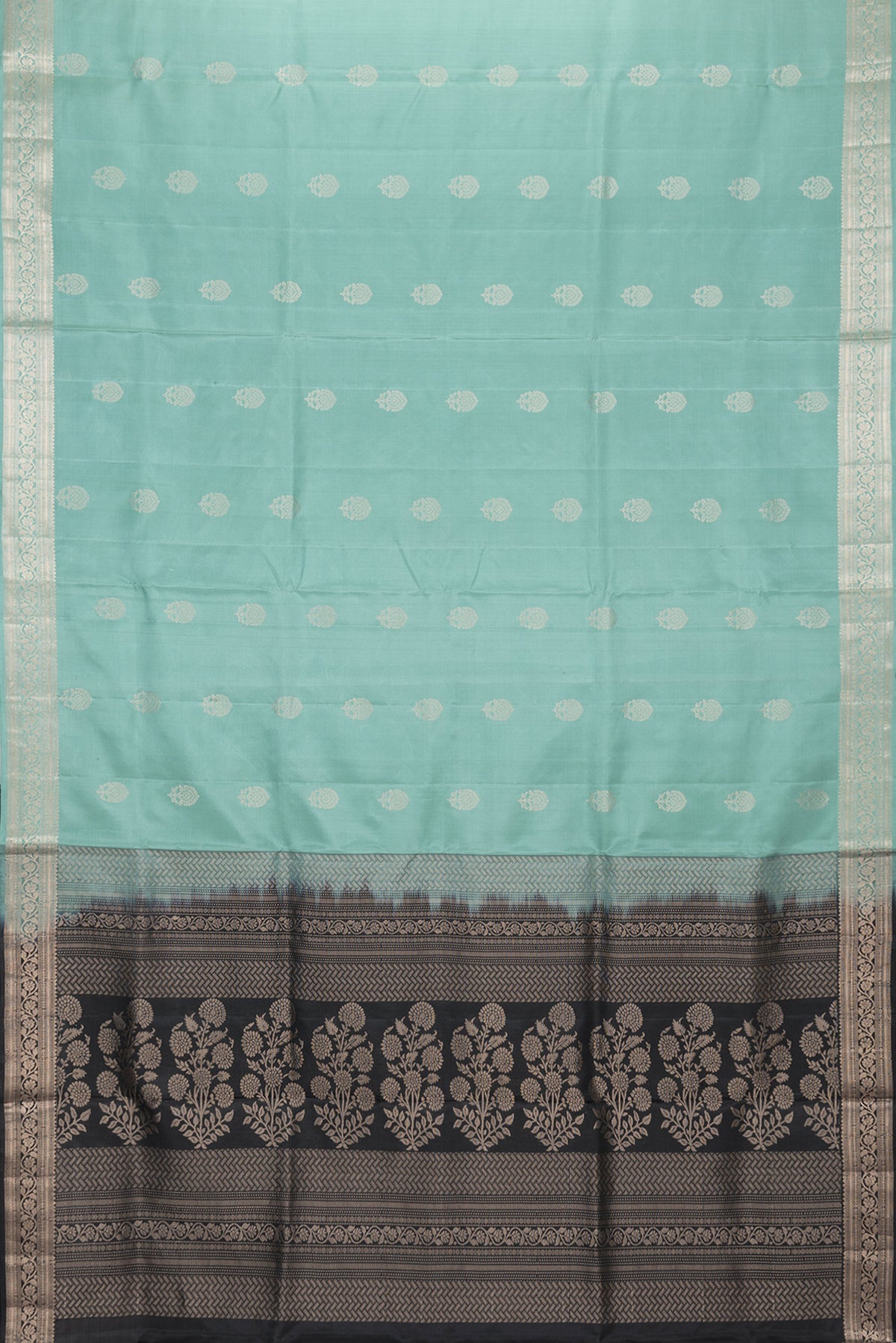 Flat view of Sea Green Dual Tone Soft Silk Saree with Zari Butta on the body and Zari Border. 