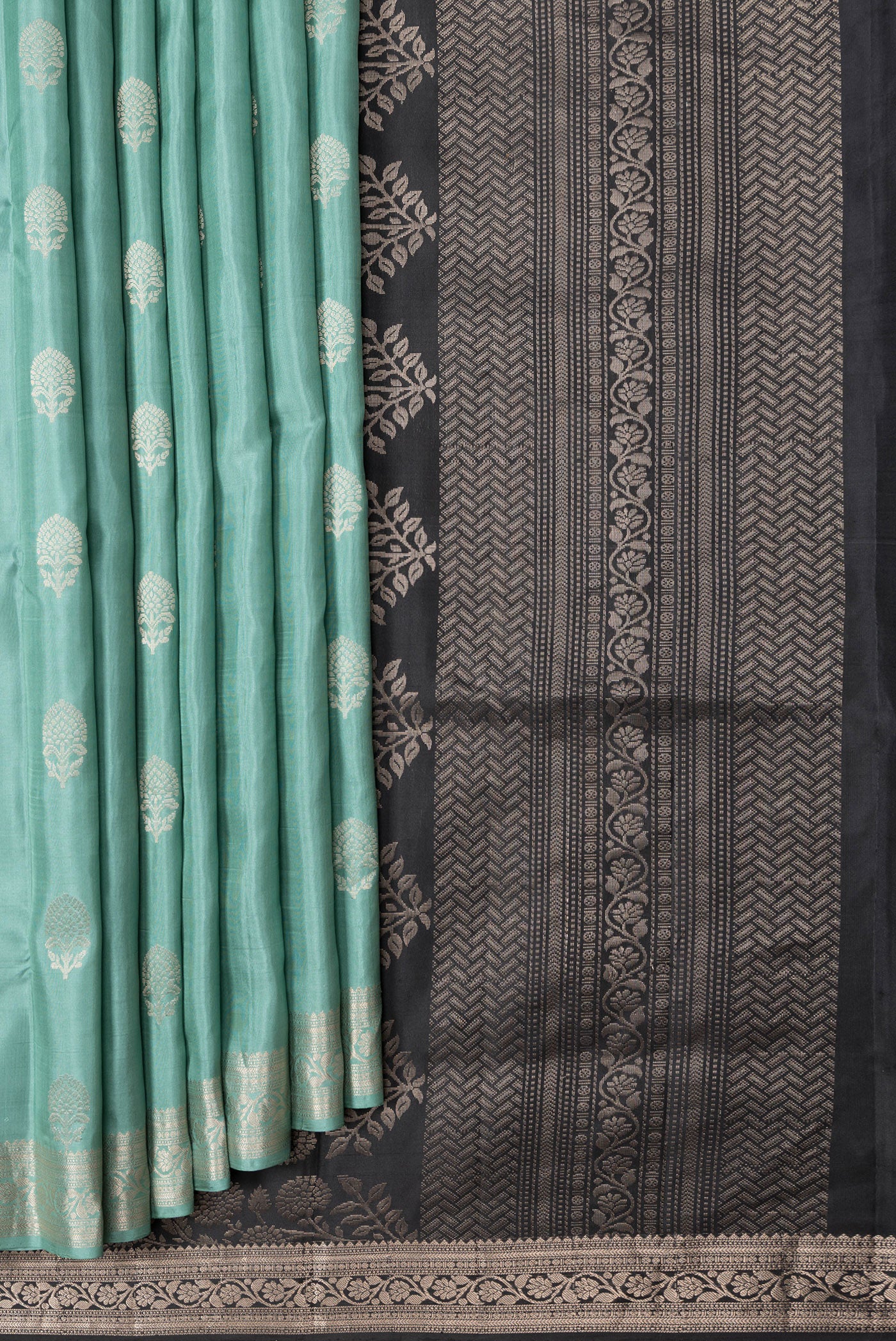 Pleats and pallu of Sea Green Dual Tone Soft Silk Saree with Zari Butta on the body and Zari Border. 