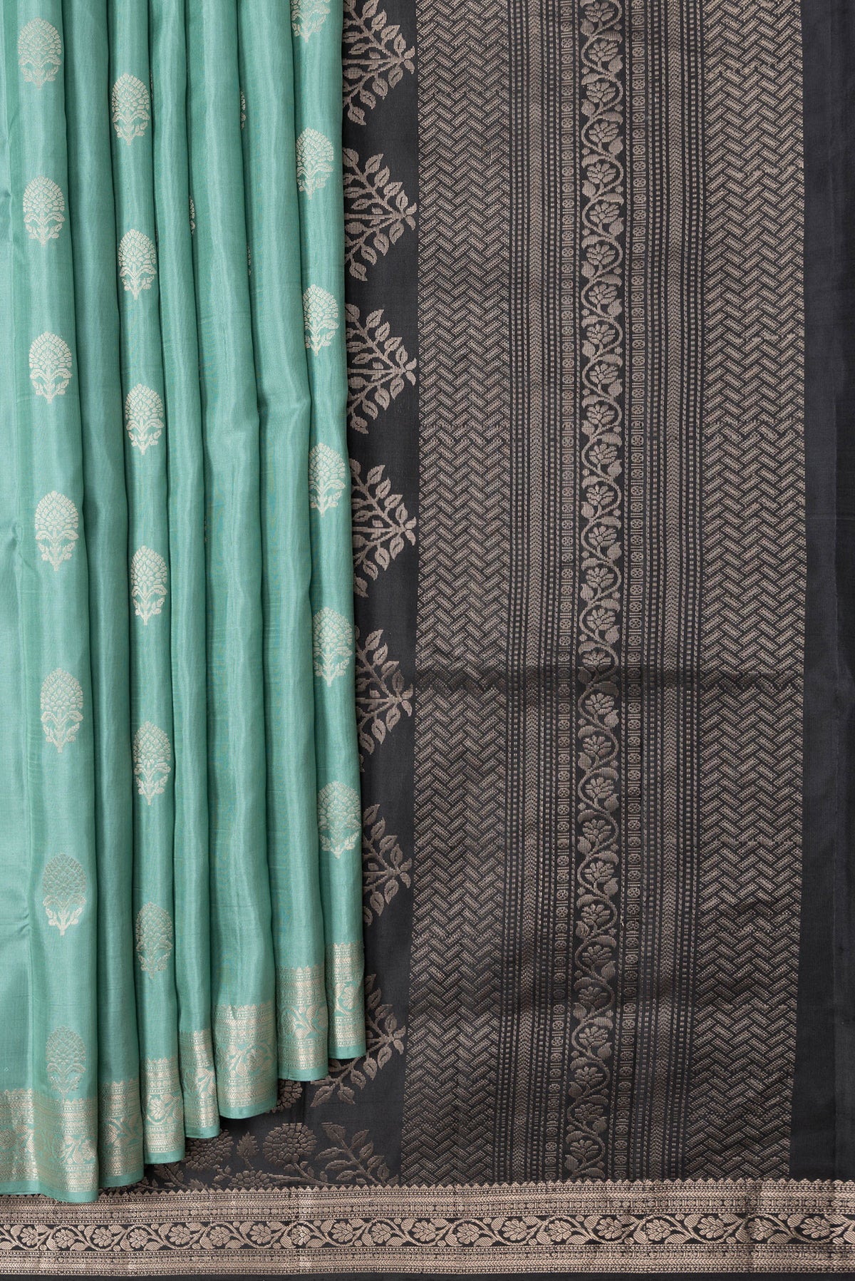 Pleats and pallu of Sea Green Dual Tone Soft Silk Saree with Zari Butta on the body and Zari Border. 