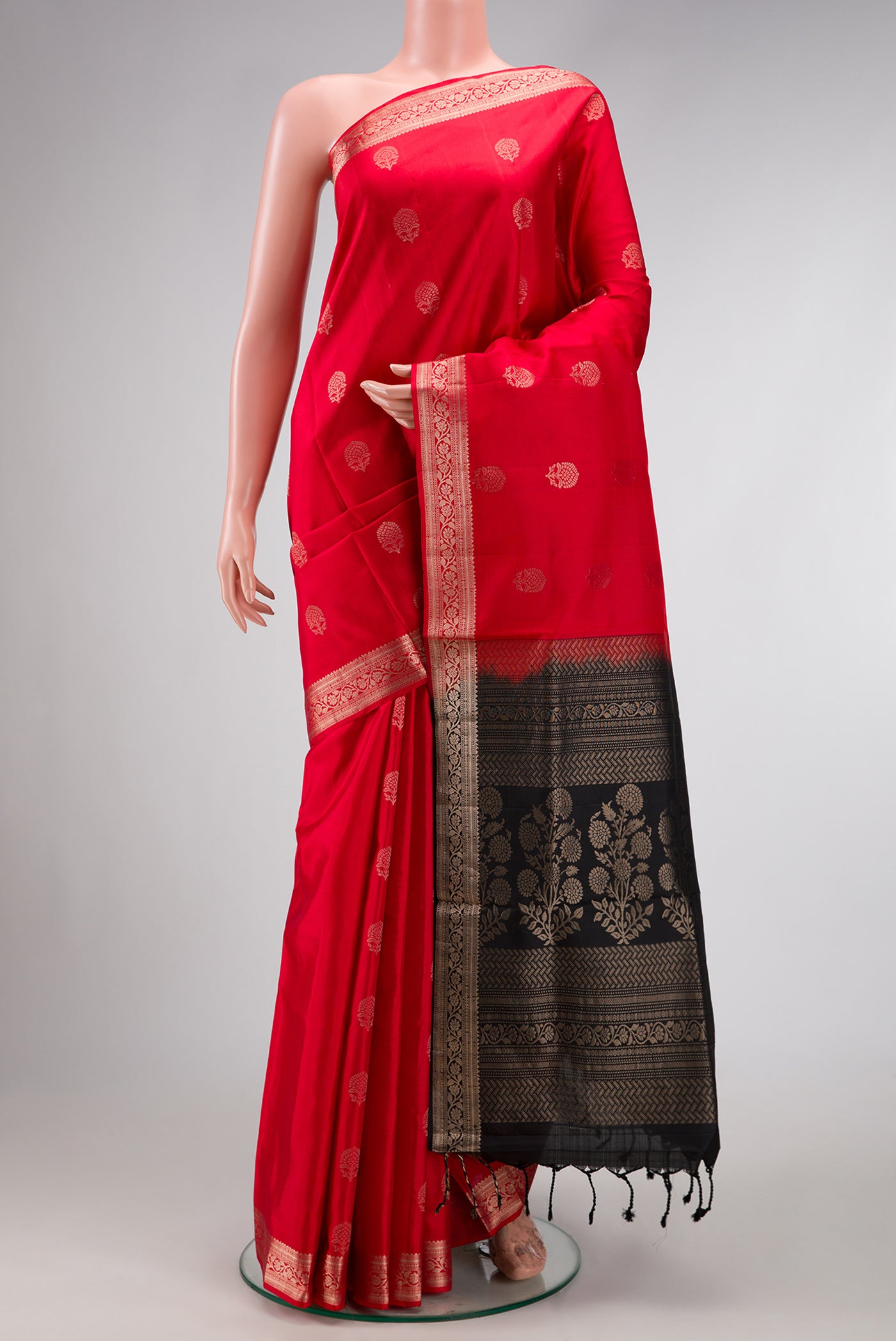 Red Dual Tone Soft Silk Saree with Zari Butta on the body and Zari Border.  displayed on a mannequin
