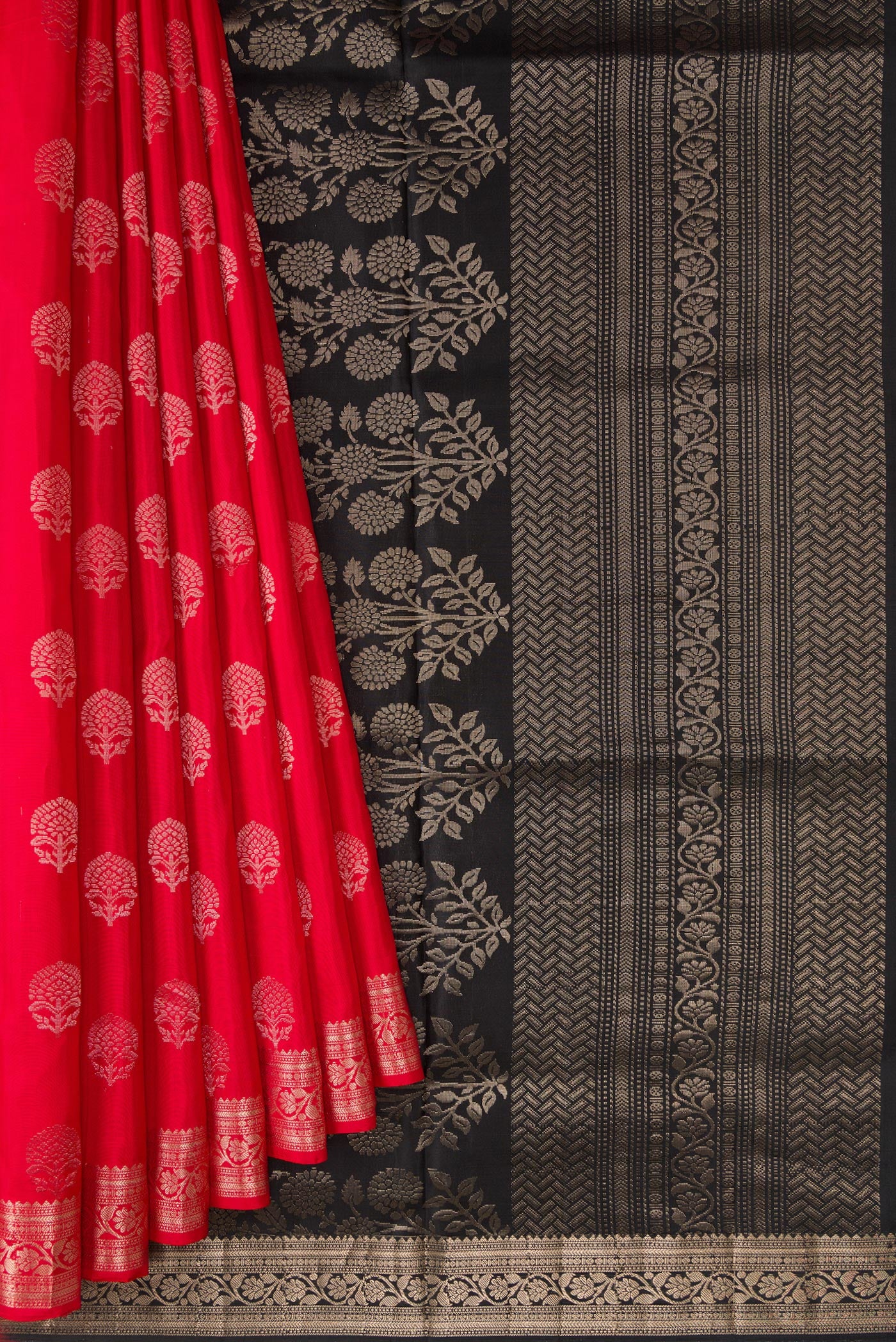 Pleats and pallu of Red Dual Tone Soft Silk Saree with Zari Butta on the body and Zari Border. 