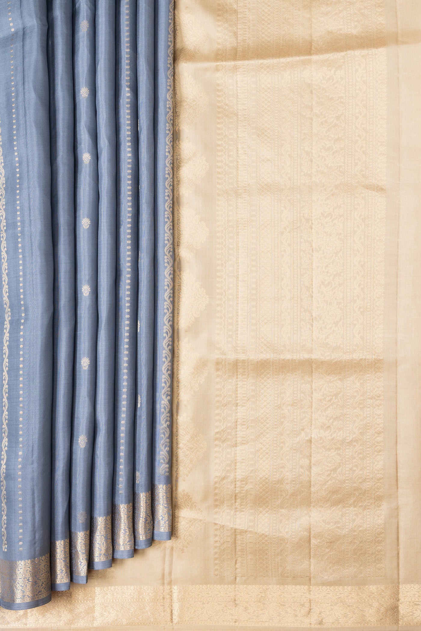 Pleats and pallu of Grey Dual Tone Soft Silk Saree with Zari Butta on the body and Zari Border. 