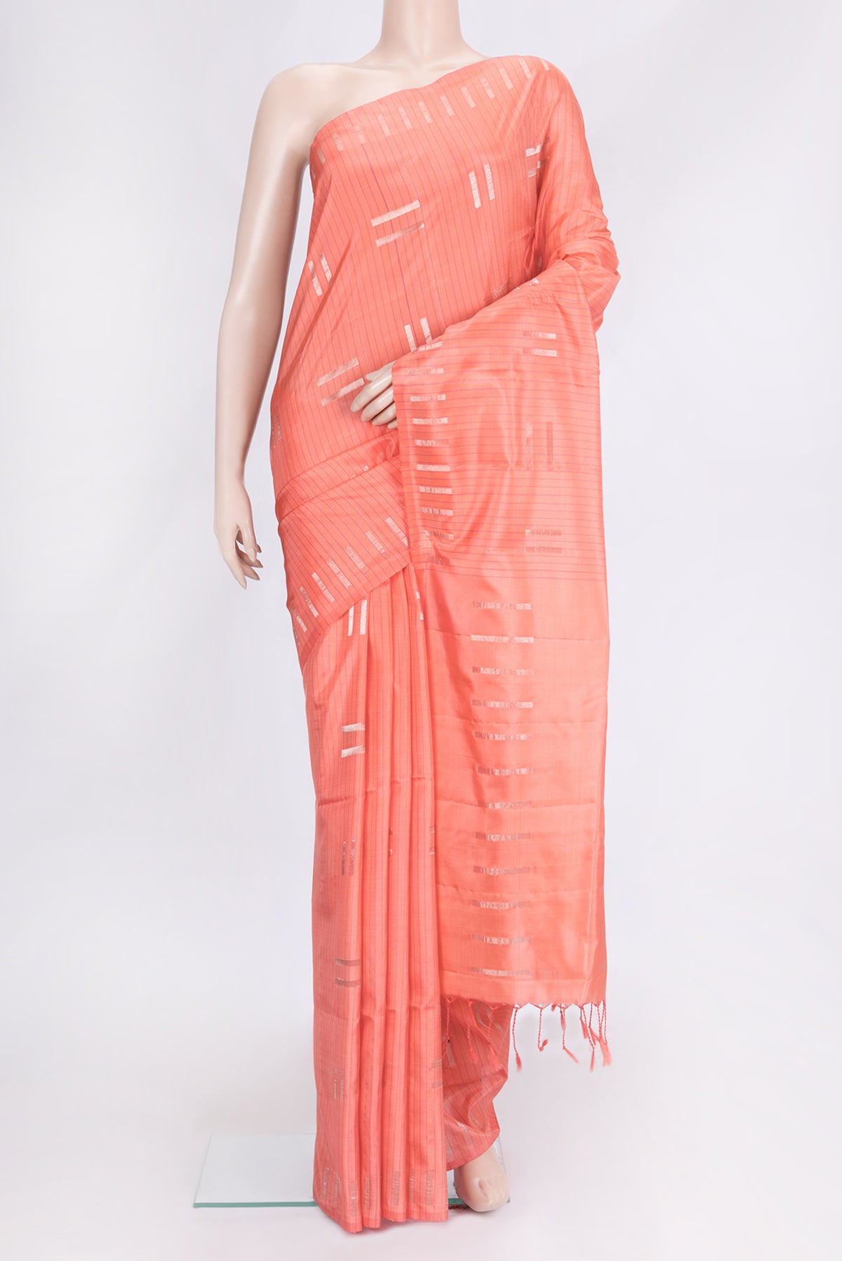 Golden Peach Dual Tone Soft Silk Saree with Zari Butta on the body and Fancy Border.  displayed on a mannequin