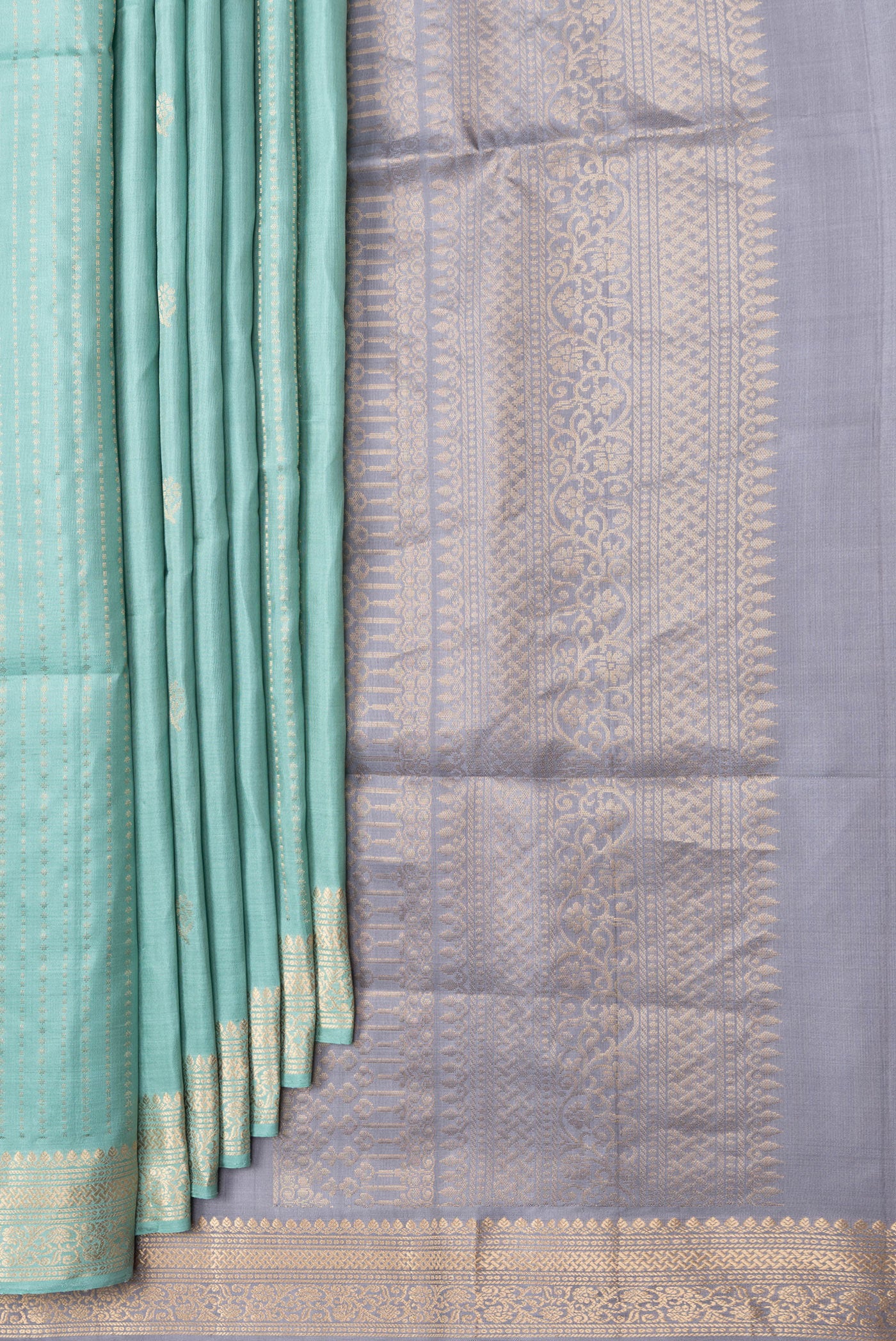 Pleats and pallu of Sky Blue Dual Tone Soft Silk Saree with Zari Butta on the body and Zari Border. 