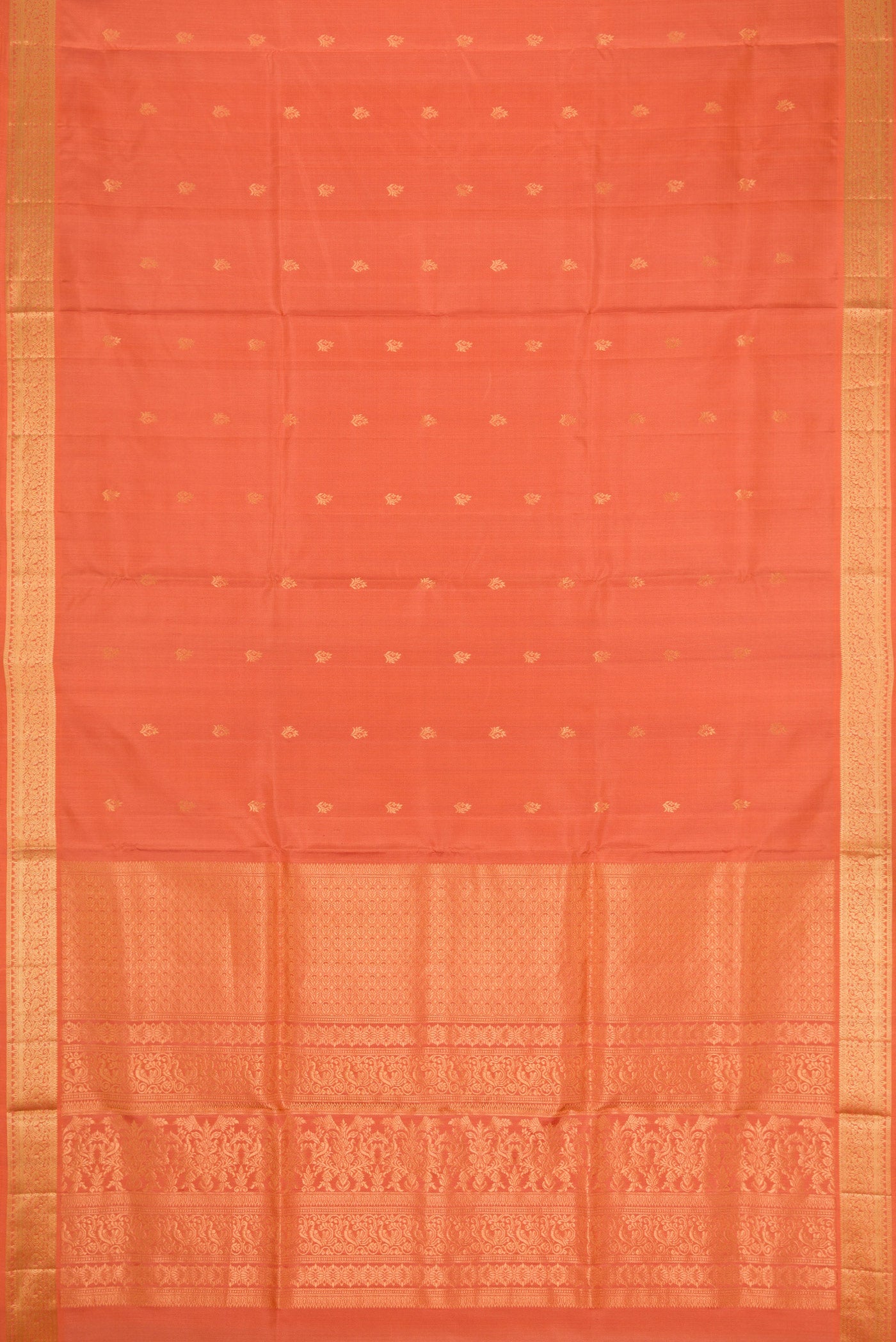 Flat view of Golden Peach Dual Tone Soft Silk Saree with Zari Butta on the body and Zari Border. 