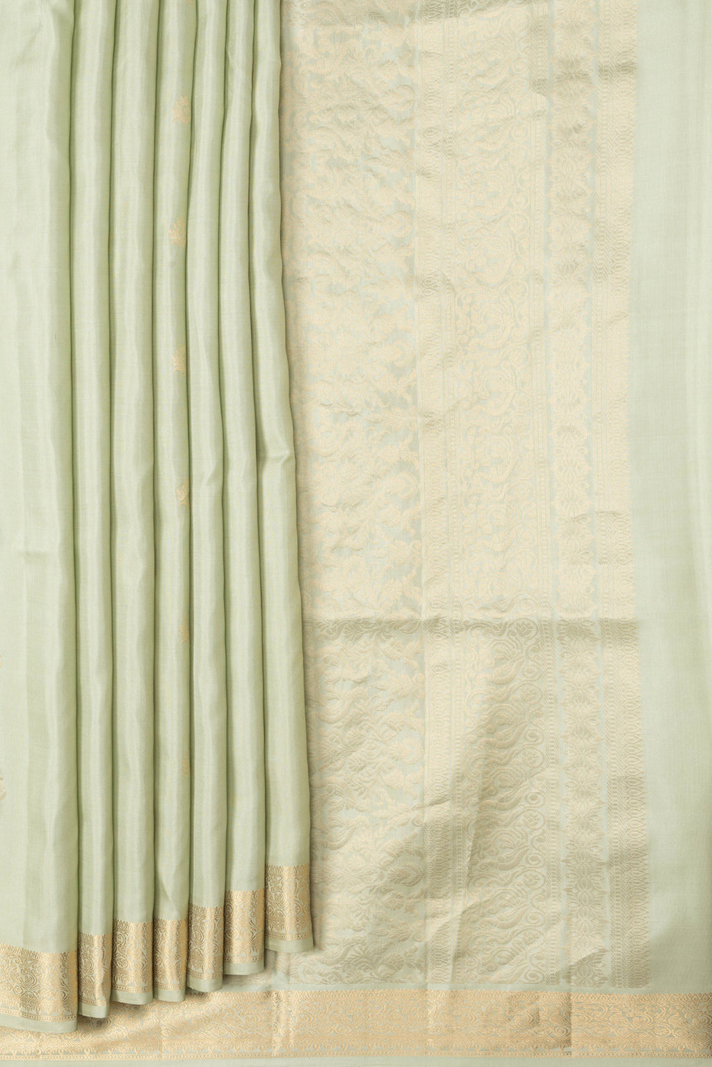Pleats and pallu of Pista Green Dual Tone Soft Silk Saree with Zari Butta on the body and Zari Border. 