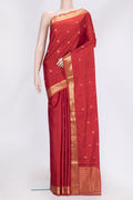 Brick Orange Dual Tone Soft Silk Saree with Zari Butta on the body and Zari Border.  displayed on a mannequin