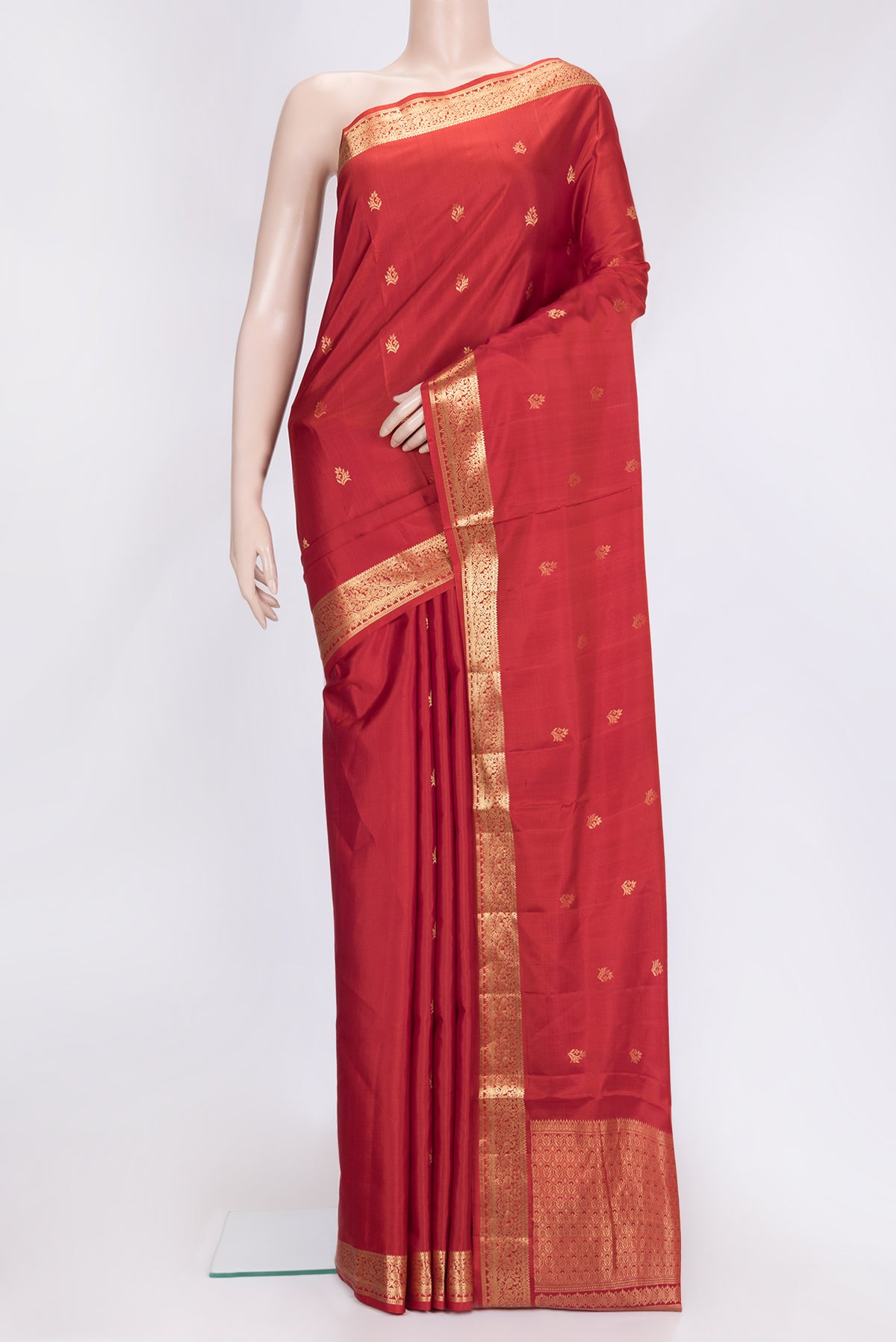 Brick Orange Dual Tone Soft Silk Saree with Zari Butta on the body and Zari Border.  displayed on a mannequin
