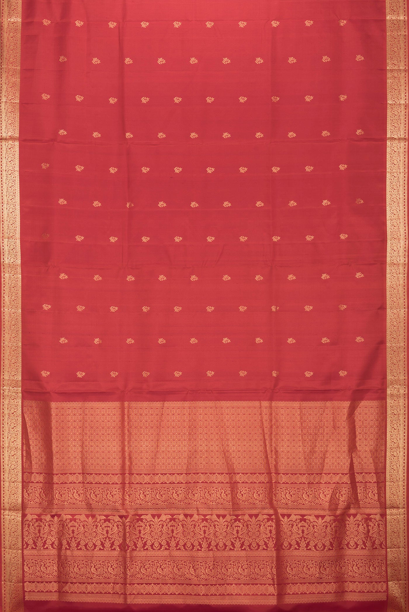 Flat view of Brick Orange Dual Tone Soft Silk Saree with Zari Butta on the body and Zari Border. 