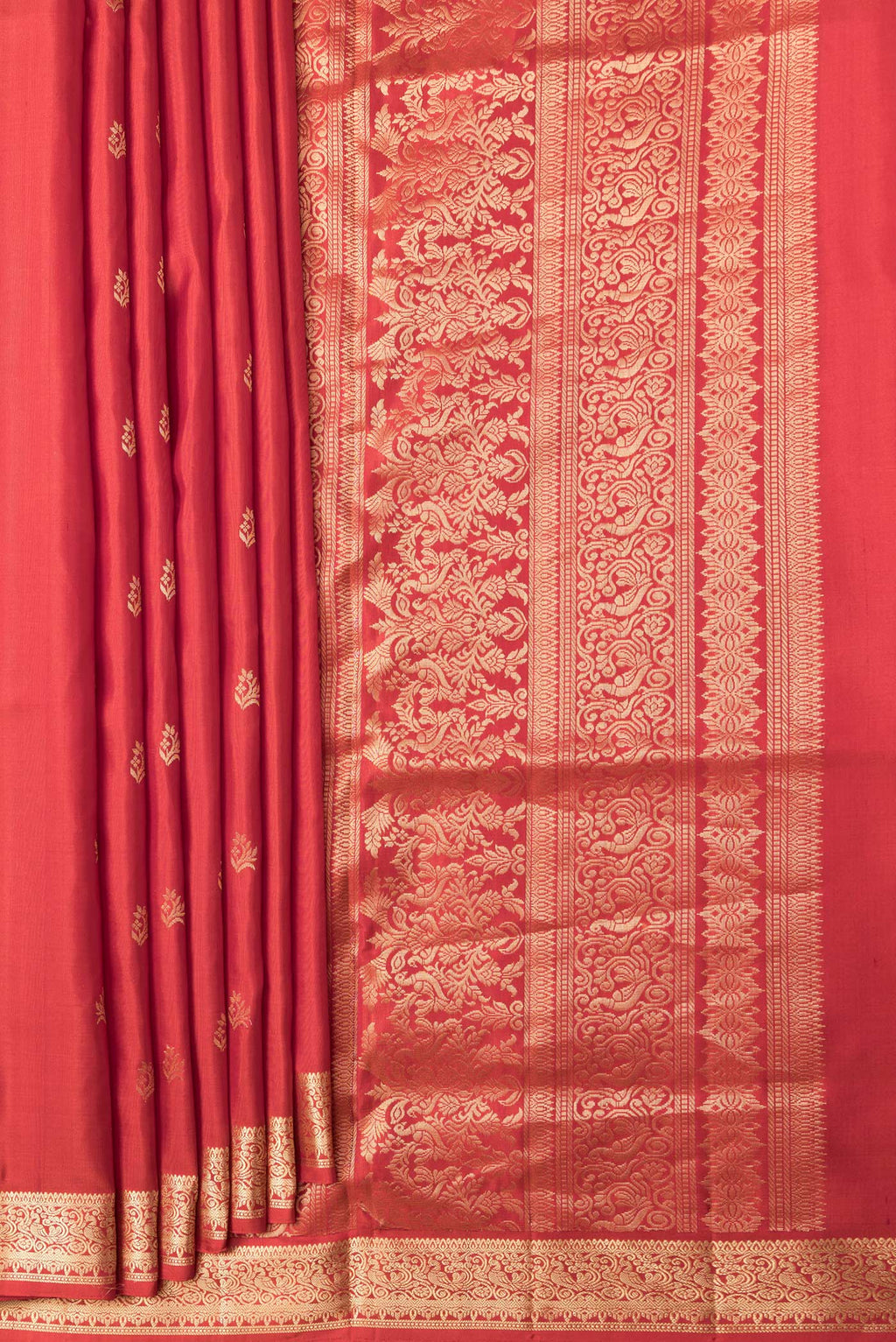 Pleats and pallu of Brick Orange Dual Tone Soft Silk Saree with Zari Butta on the body and Zari Border. 