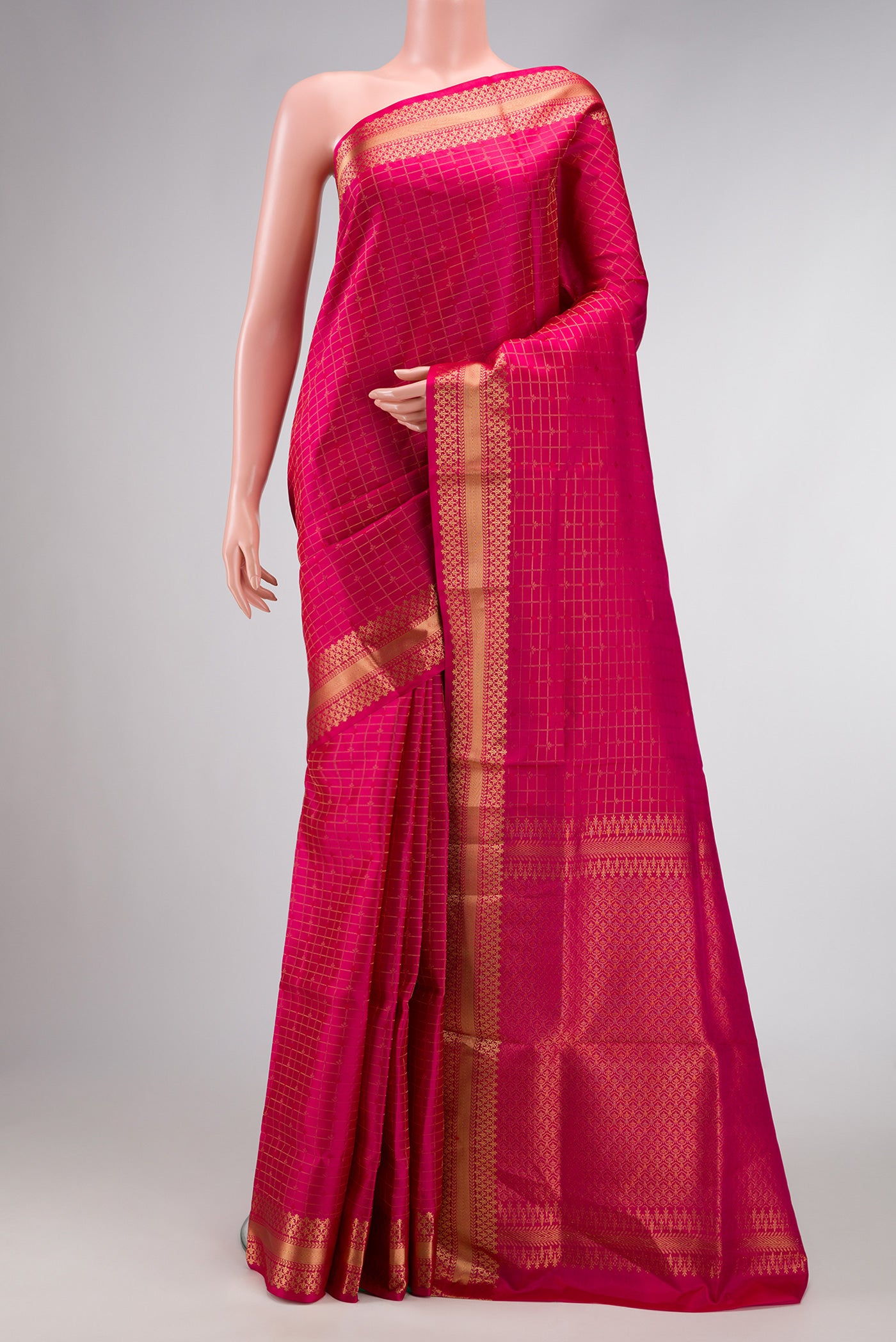Dark Pink Dual Tone Soft Silk Saree with Checked design on the body and Zari Border.  displayed on a mannequin