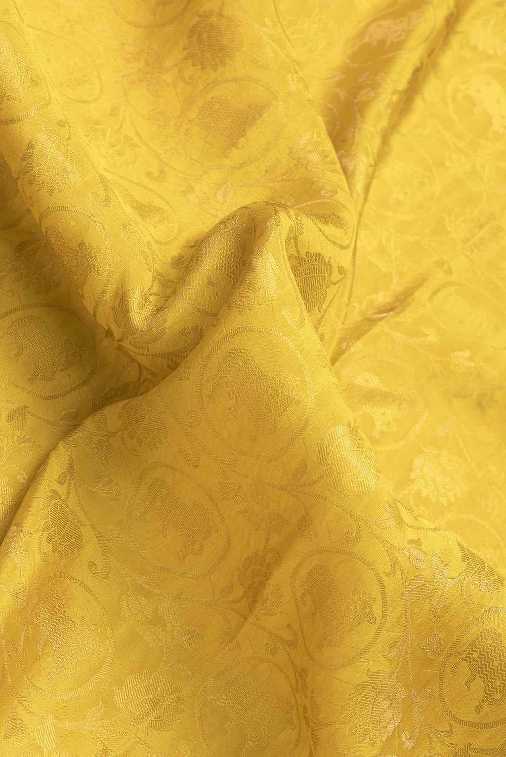 Close up of Yellow Dual Tone Mysore Silk Saree with Zari Brocade on the body and Zari Border.  displaying folds