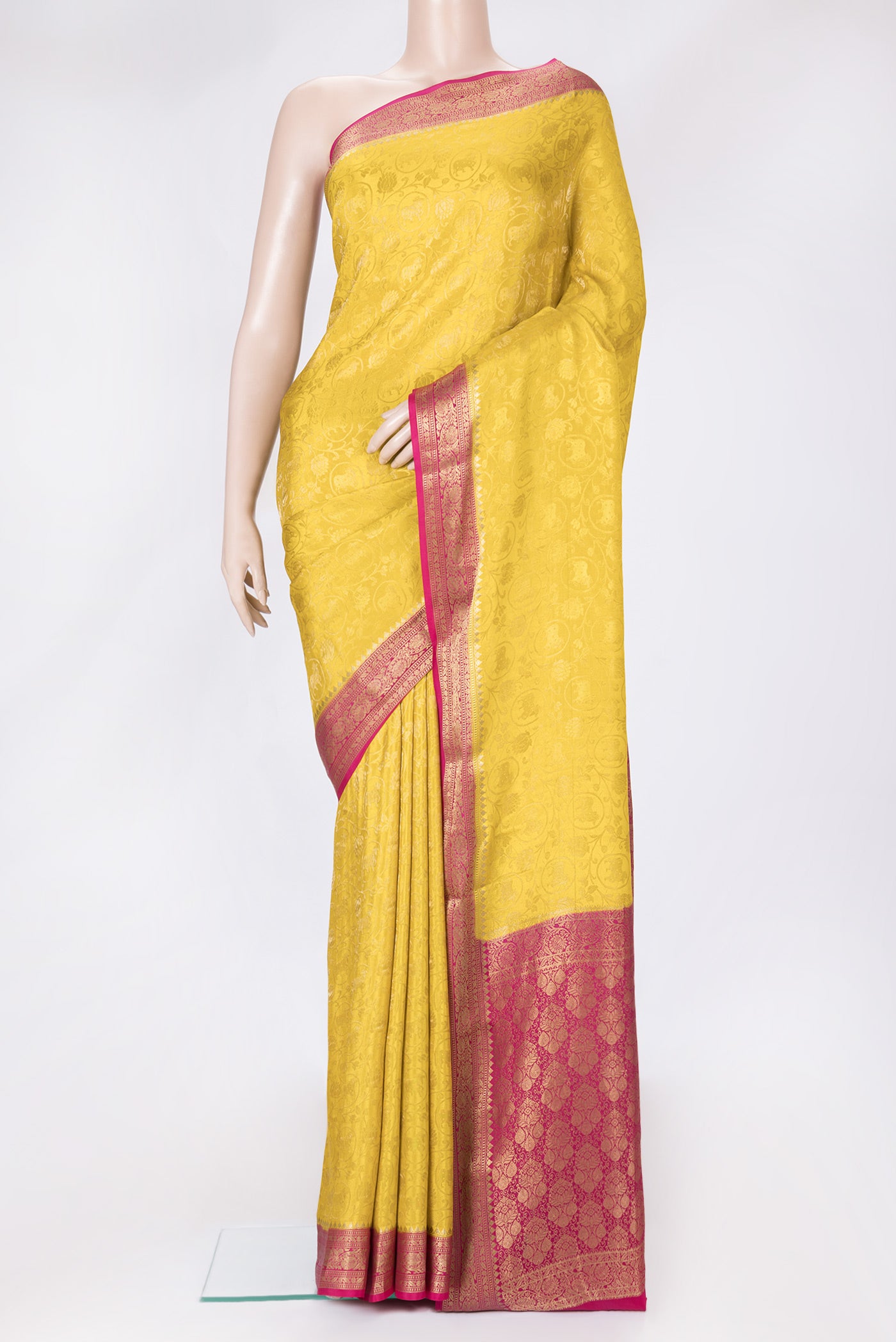 Yellow Dual Tone Mysore Silk Saree with Zari Brocade on the body and Zari Border.  displayed on a mannequin