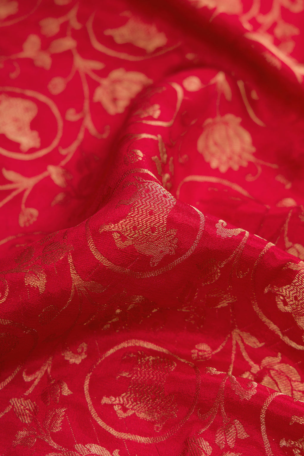 Close up of Red Dual Tone Mysore Silk Saree with Zari Brocade on the body and Zari Border.  displaying folds