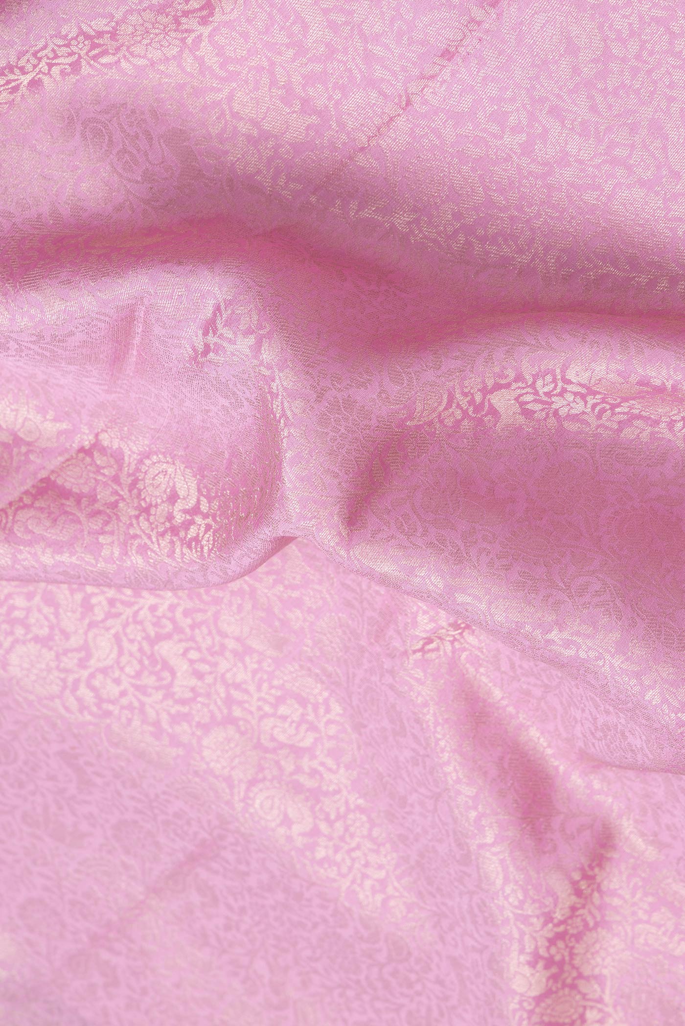 Close up of Pink Dual Tone Mysore Silk Saree with Zari Brocade on the body and Zari Border.  displaying folds