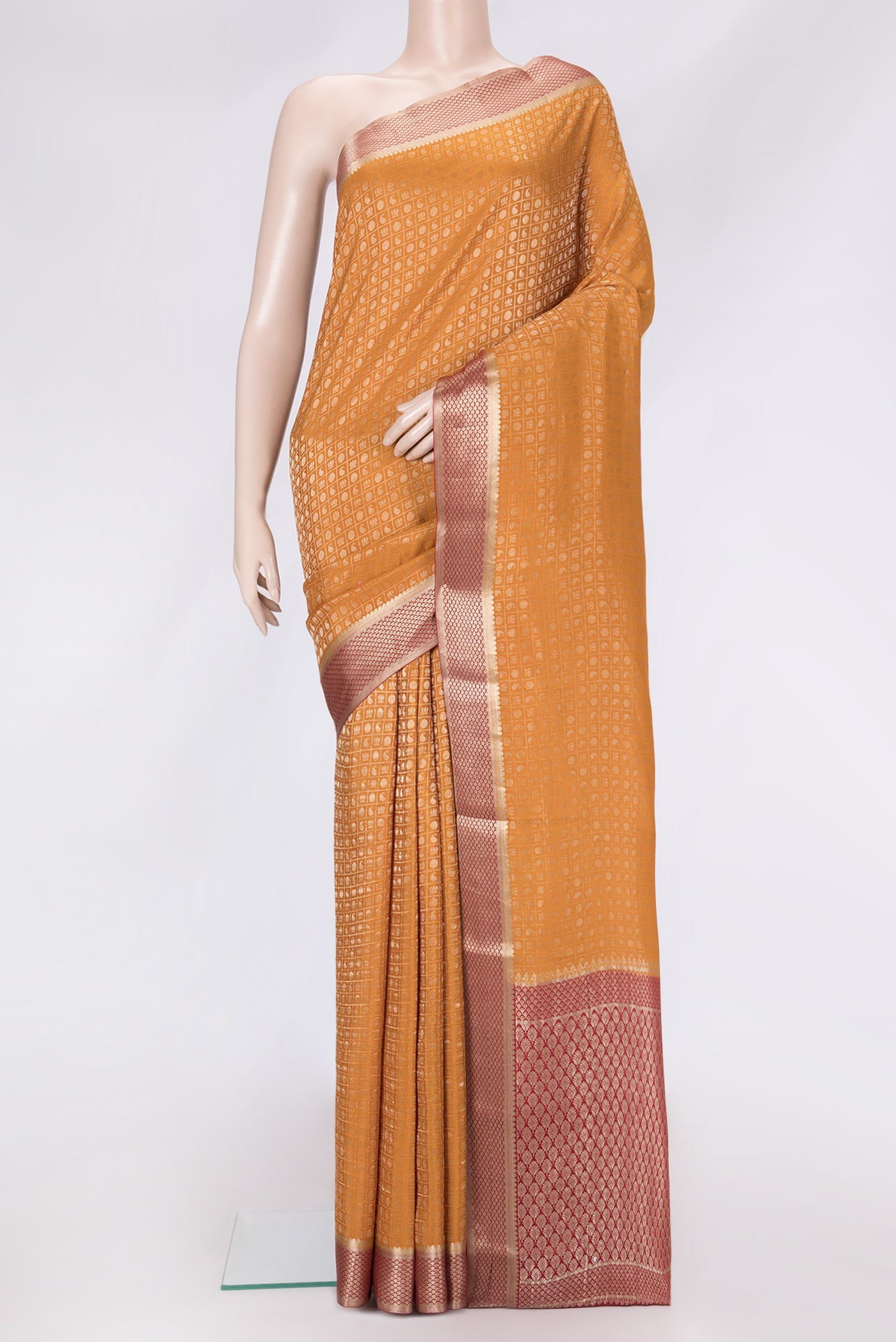 Mustard Dual Tone Tussar Silk Saree with Zari Brocade on the body and Zari Border.  displayed on a mannequin