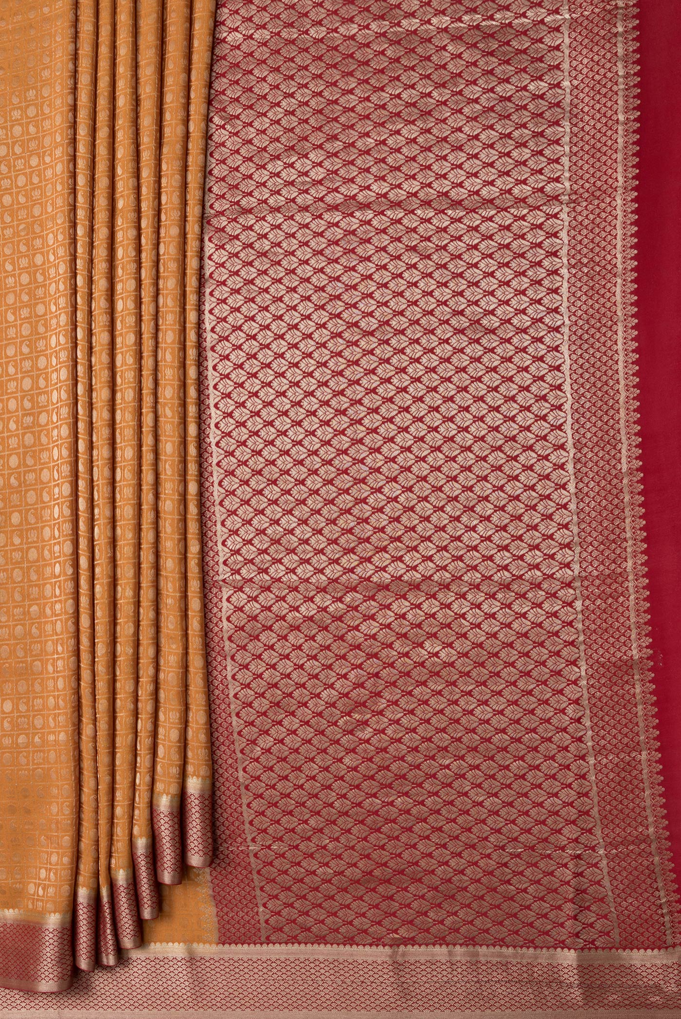 Pleats and pallu of Mustard Dual Tone Tussar Silk Saree with Zari Brocade on the body and Zari Border. 