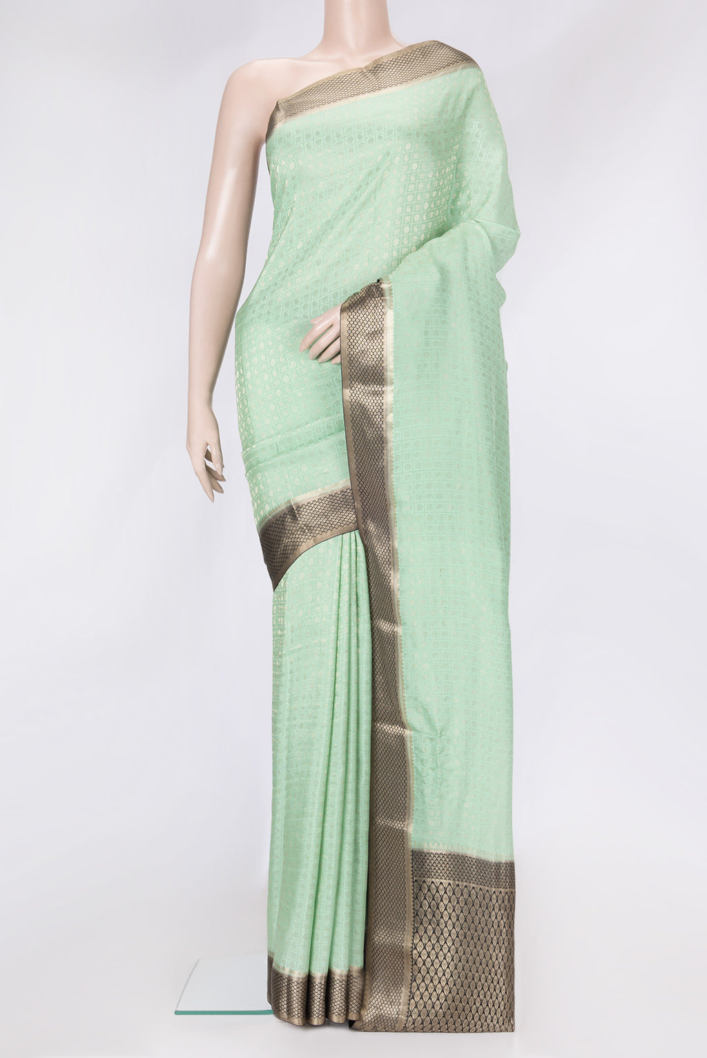 Pista Green Dual Tone Tussar Silk Saree with Zari Brocade on the body and Zari Border.  displayed on a mannequin
