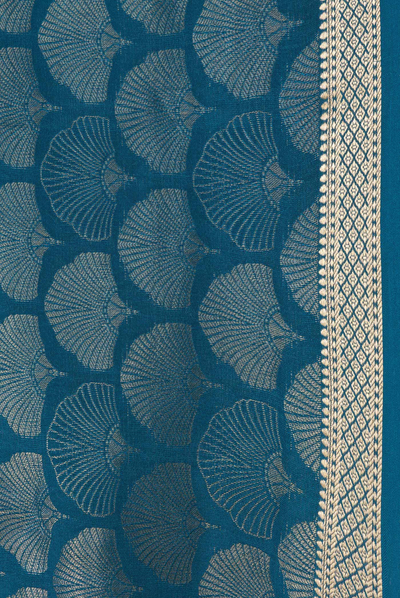 Border image of Peacock Blue Dual Tone Tussar Silk Saree with Zari Brocade on the body and Zari Border. 