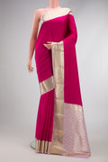 Dark Pink Mysore Crepe Saree with Plain Body and Zari Border.  displayed on a mannequin
