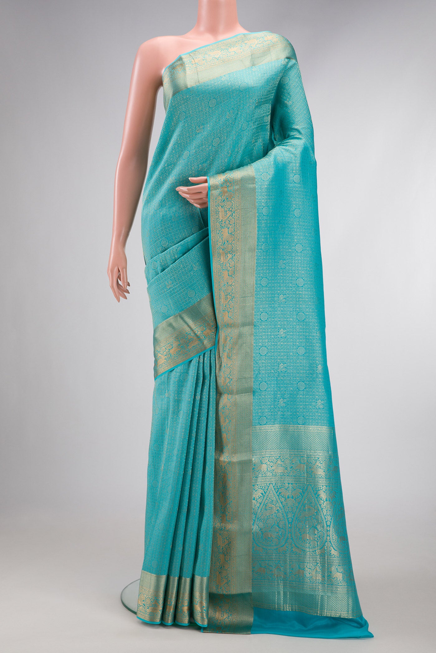 Sky Blue Dual Tone Mysore Crepe Saree with Zari Brocade on the body and Zari Border.  displayed on a mannequin