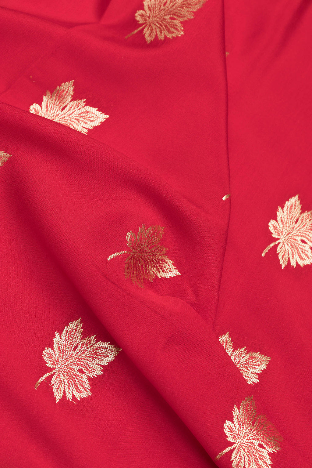Close up of Red Dual Tone Mysore Silk Saree with Zari Butta on the body and Zari Border.  displaying folds