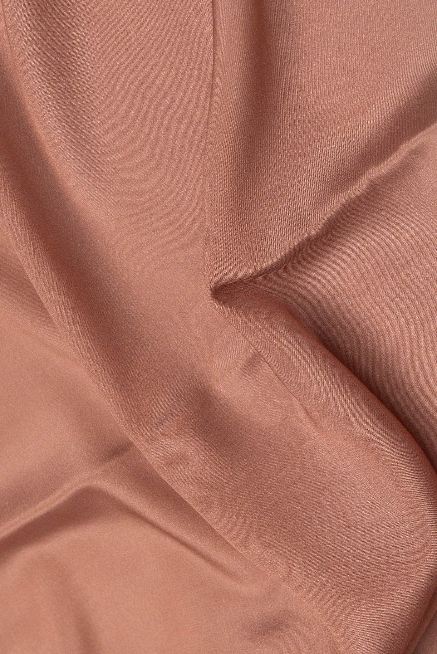 Close up of Brown Dual Tone Mysore Silk Saree with Plain Body and Fancy Border.  displaying folds