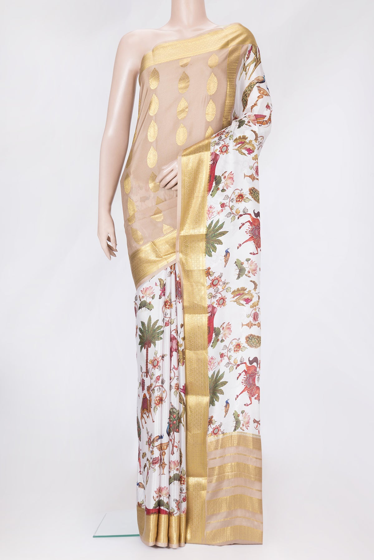 Off White Dual Tone Mysore Silk Saree with Printed design on the body and Zari Border.  displayed on a mannequin