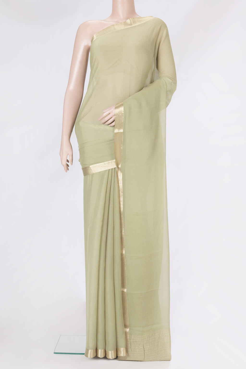 Pista Green Mysore Chiffon Saree with Plain Body and Zari Border.  displayed on a mannequin