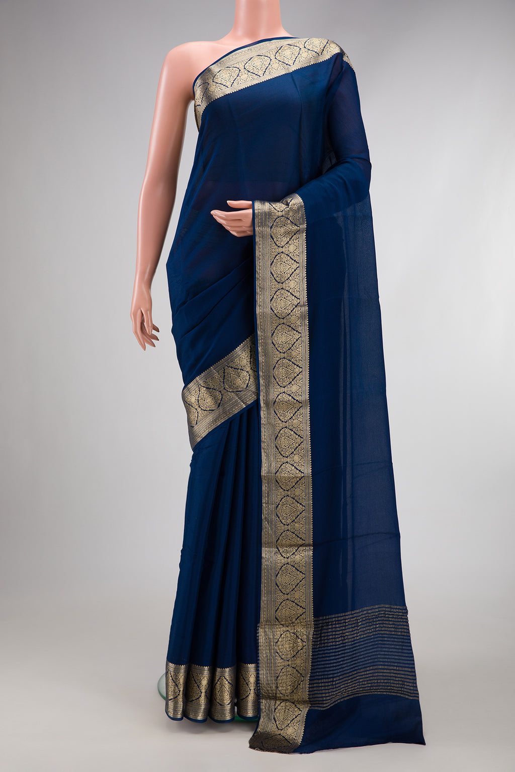 Blue Georgette Saree with Plain Body and Zari Border.  displayed on a mannequin