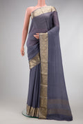 Grey Georgette Saree with Plain Body and Zari Border.  displayed on a mannequin