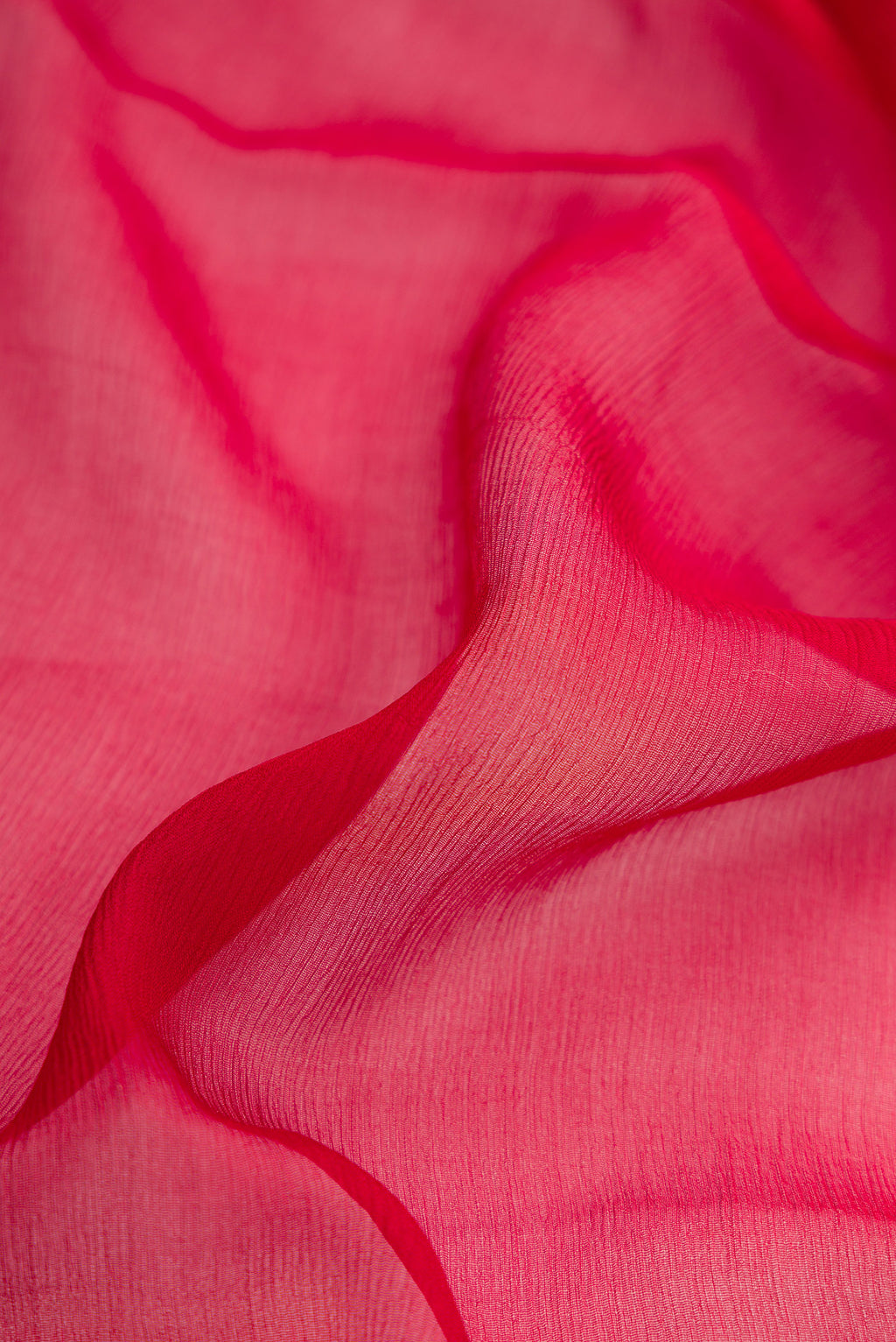 Close up of Maroon Dual Tone Mysore Chiffon Saree with Plain Body and Zari Border.  displaying folds