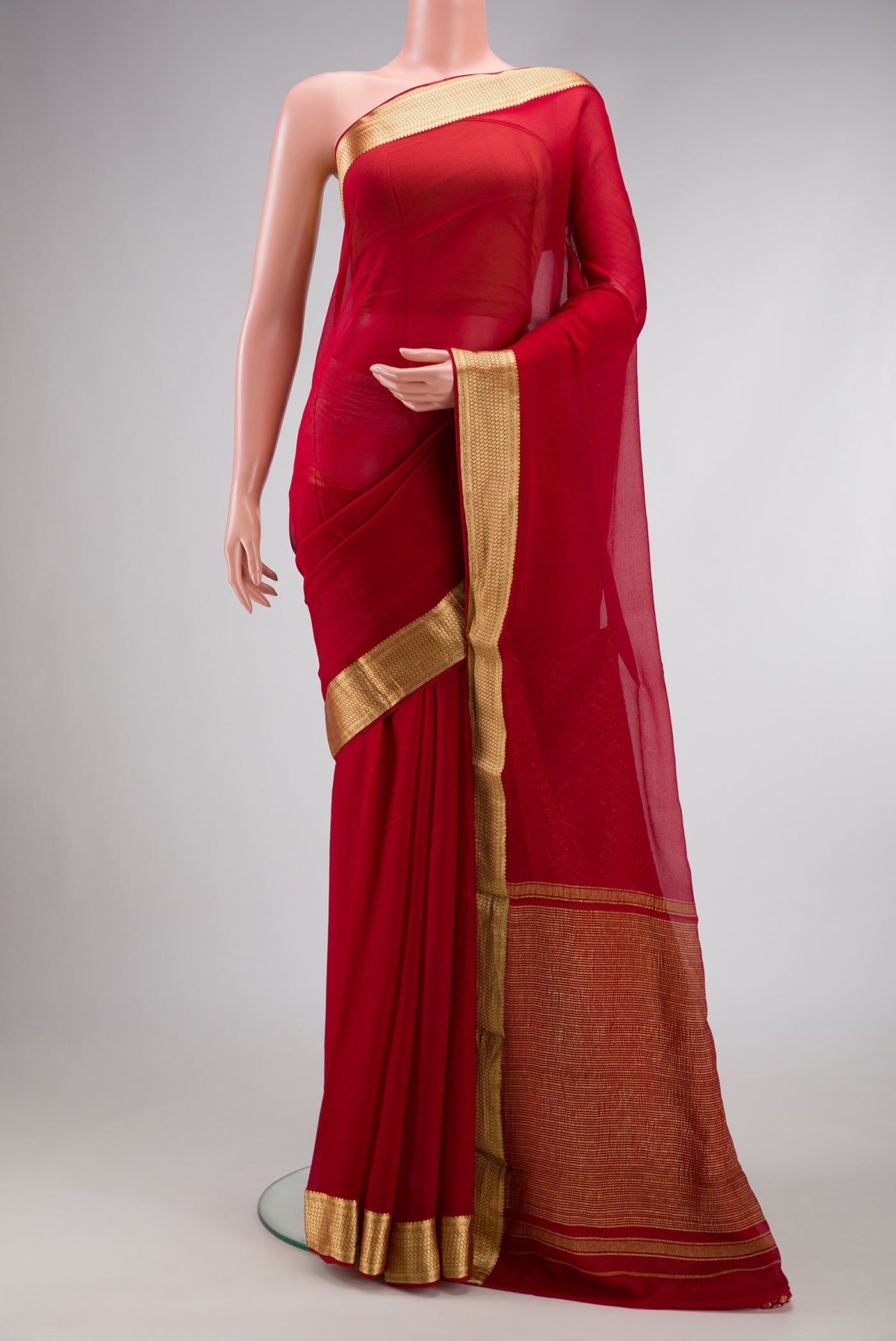 Maroon Dual Tone Mysore Chiffon Saree with Plain Body and Zari Border.  displayed on a mannequin