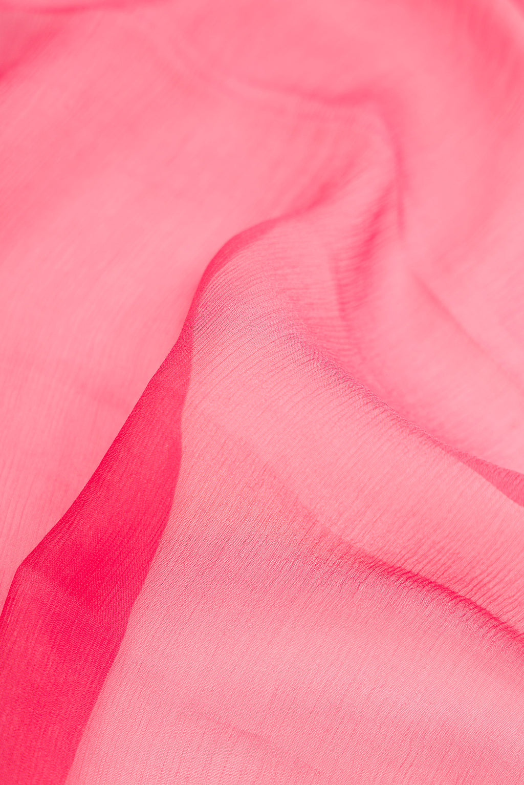 Close up of Pink Dual Tone Mysore Chiffon Saree with Plain Body and Zari Border.  displaying folds