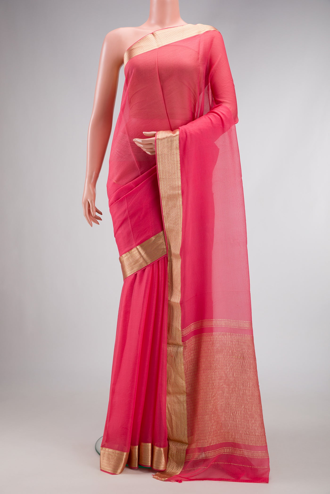 Pink Dual Tone Mysore Chiffon Saree with Plain Body and Zari Border.  displayed on a mannequin