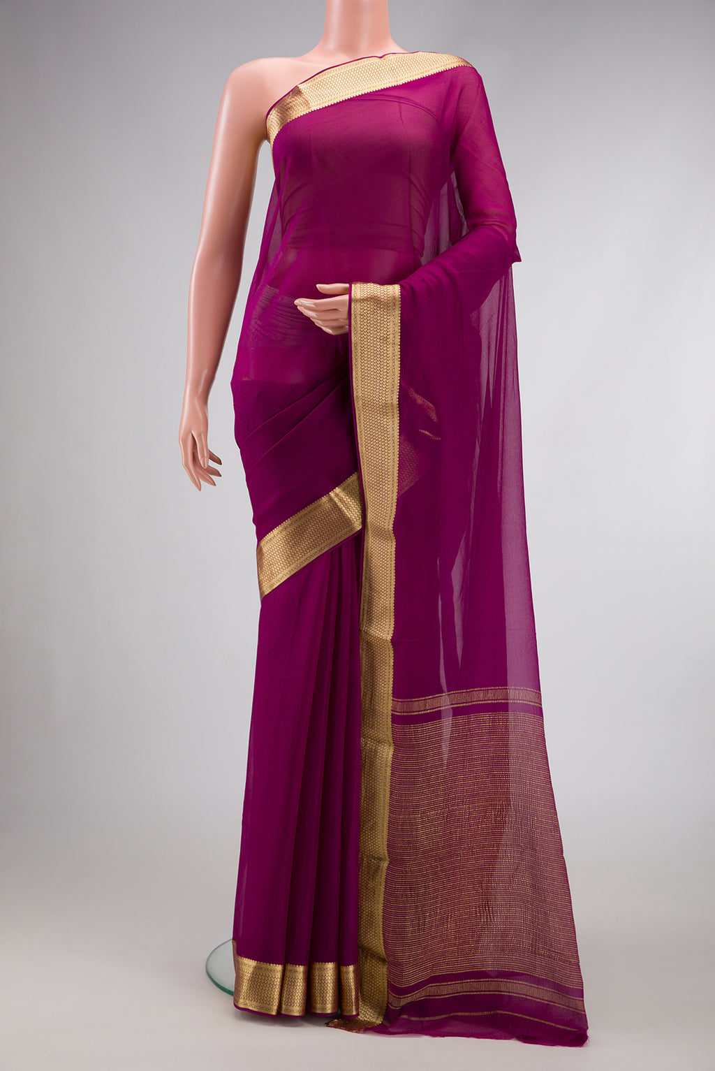 Magenta Dual Tone Mysore Georgette Saree with Plain Body and Zari Border.  displayed on a mannequin