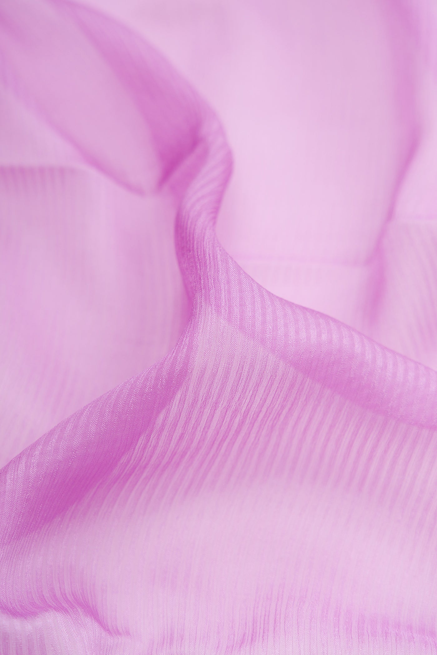 Close up of Lavender Mysore Georgette Saree with Stripes on the body and Zari Border.  displaying folds