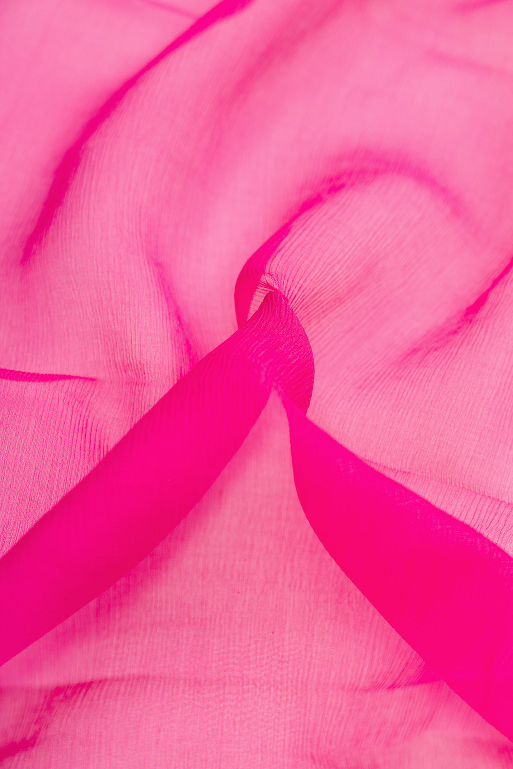 Close up of Pink Dual Tone Mysore Chiffon Saree with Plain Body and Zari Border.  displaying folds