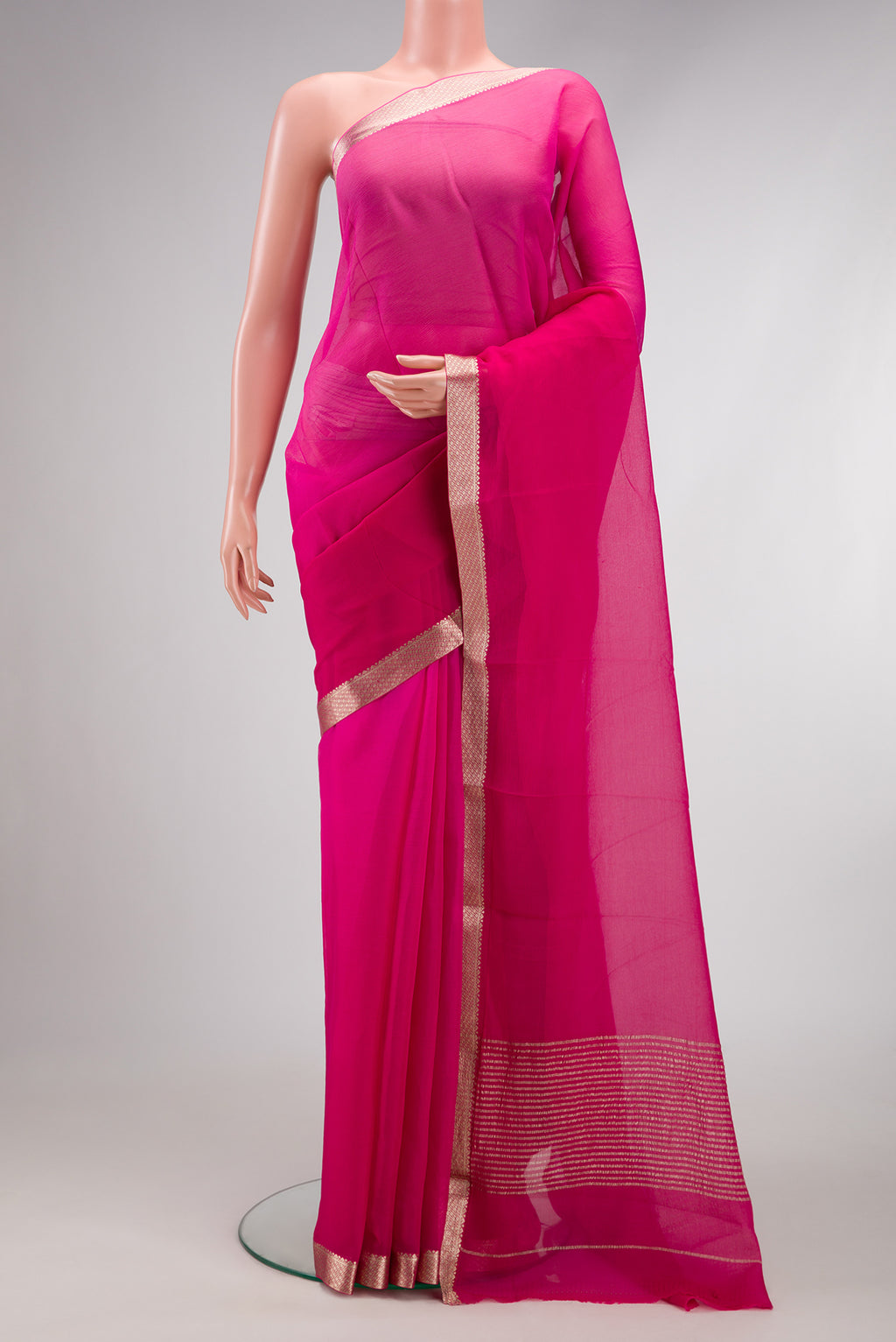 Pink Dual Tone Mysore Chiffon Saree with Plain Body and Zari Border.  displayed on a mannequin