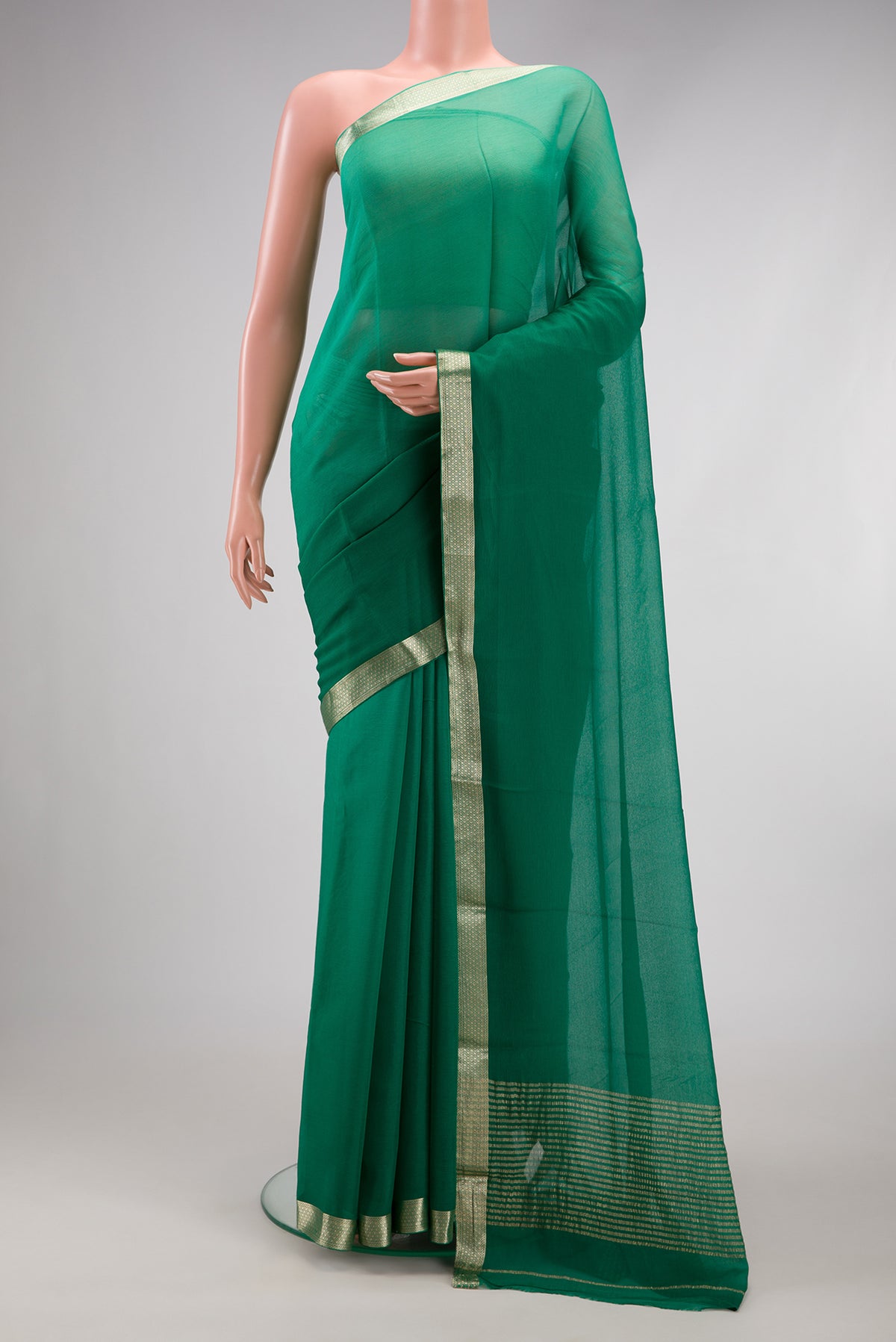 Green Mysore Chiffon Saree with Plain Body and Zari Border.  displayed on a mannequin