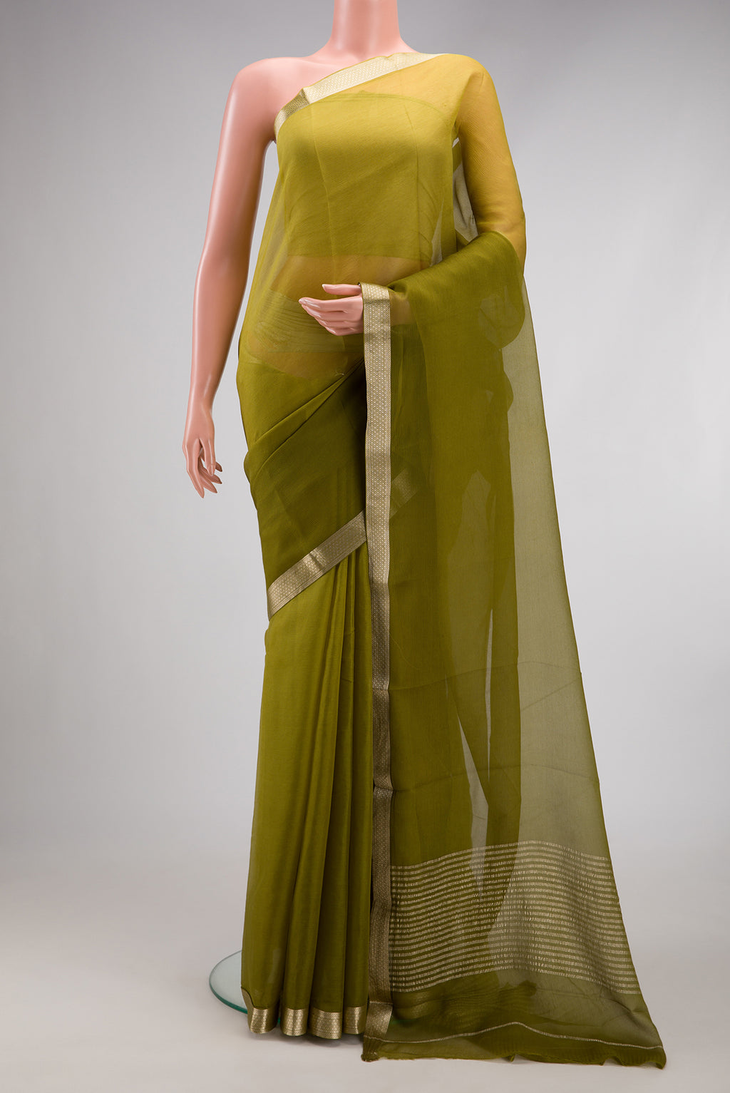 Mehandi Green Mysore Chiffon Saree with Plain Body and Zari Border.  displayed on a mannequin
