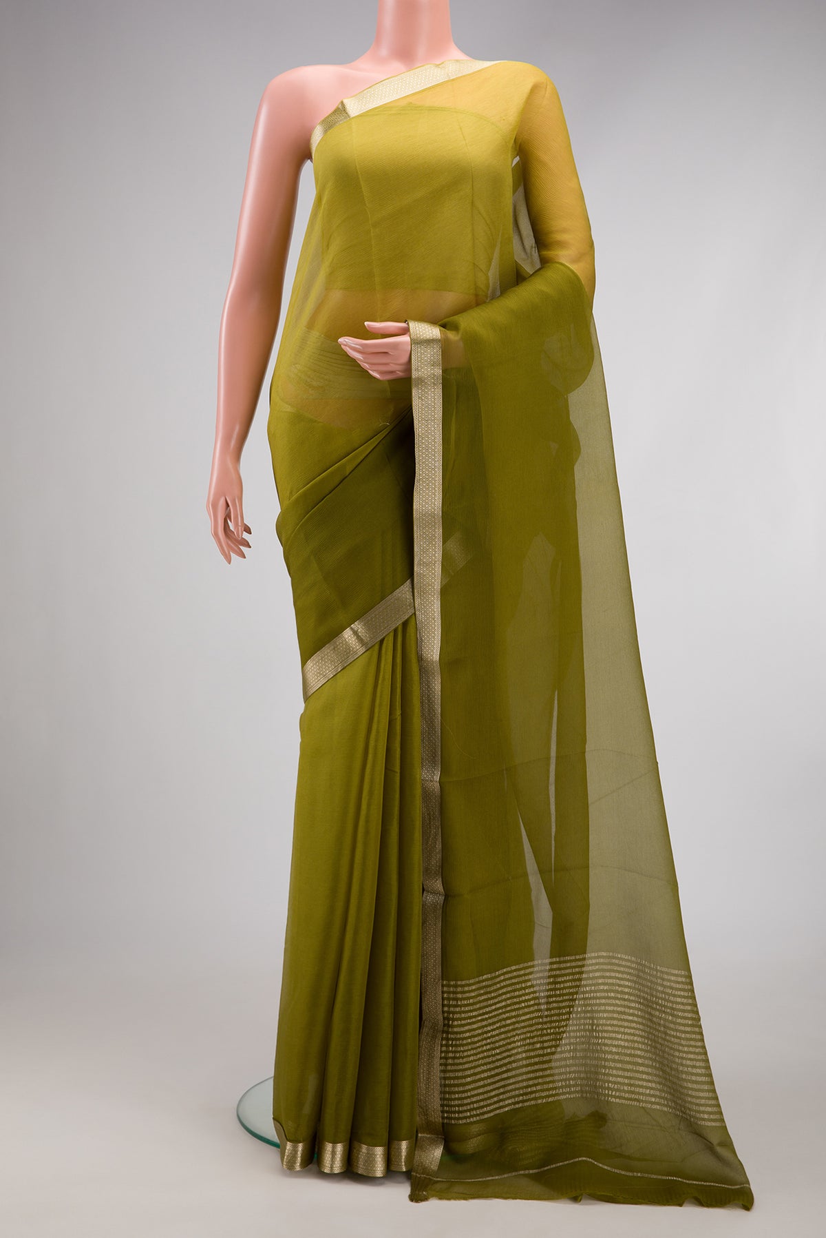 Mehandi Green Mysore Chiffon Saree with Plain Body and Zari Border.  displayed on a mannequin