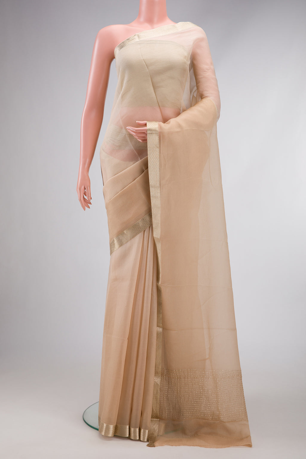 Beige Dual Tone Mysore Chiffon Saree with Plain Body and Zari Border.  displayed on a mannequin
